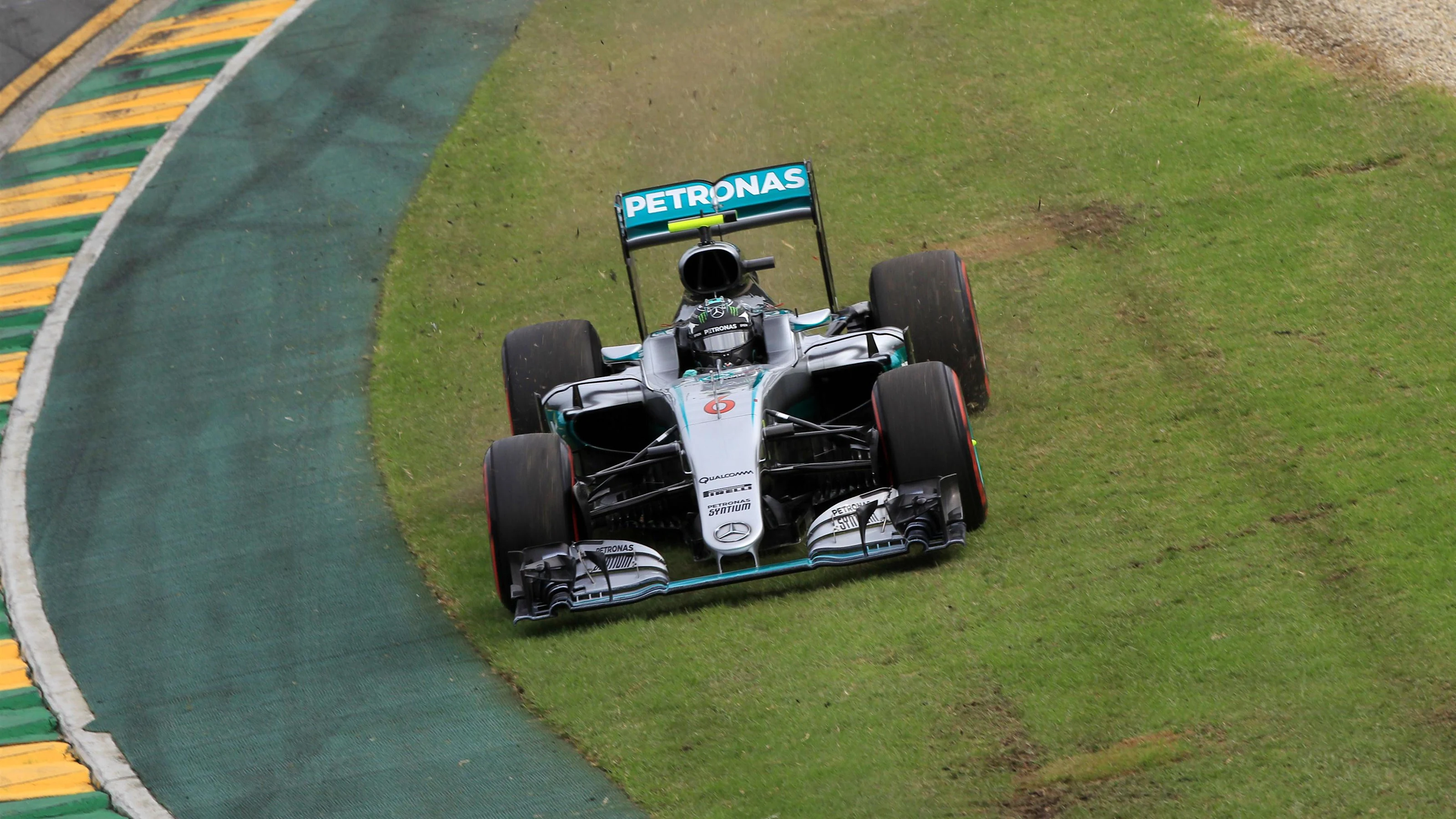 Nico Rosberg (GER) Mercedes-Benz F1 W07 Hybrid cuts across the grass at Formula One World