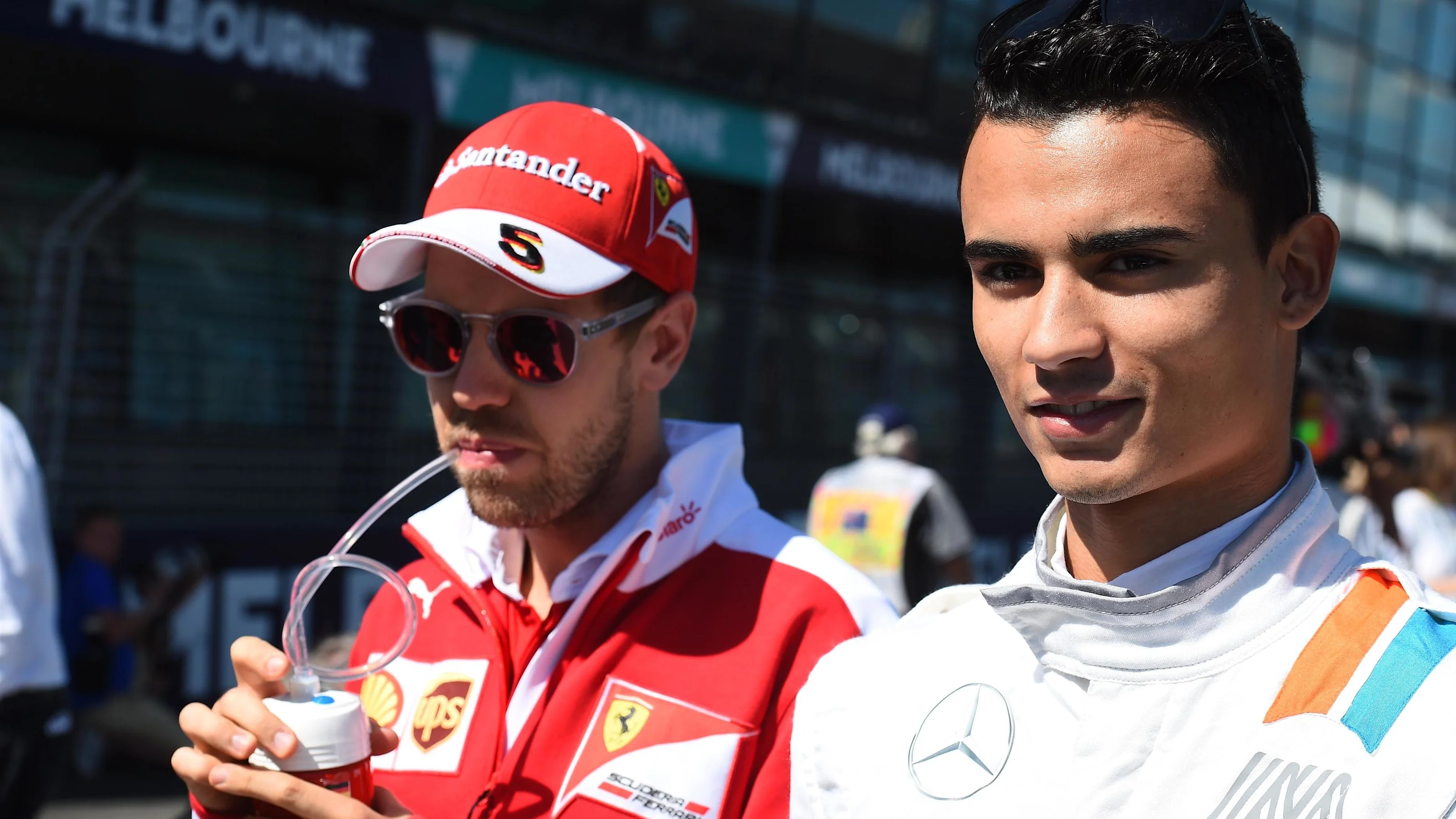 Sebastian Vettel (GER) Ferrari and Pascal Wehrlein (GER) Manor Racing on the grid at Formula One