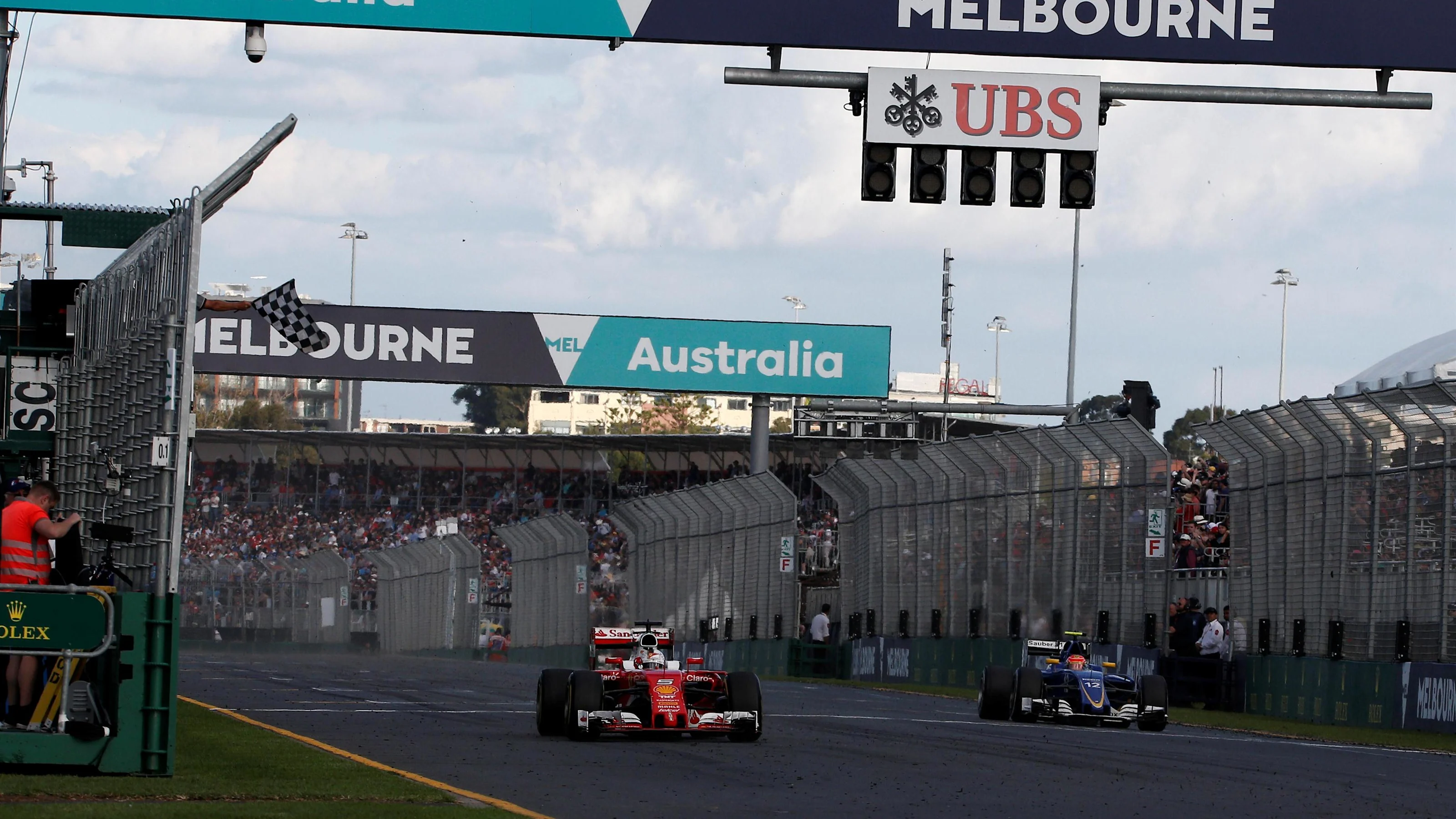 Third placed Sebastian Vettel (GER) Ferrari SF16-H tcrosses the line and takes the chequered flag