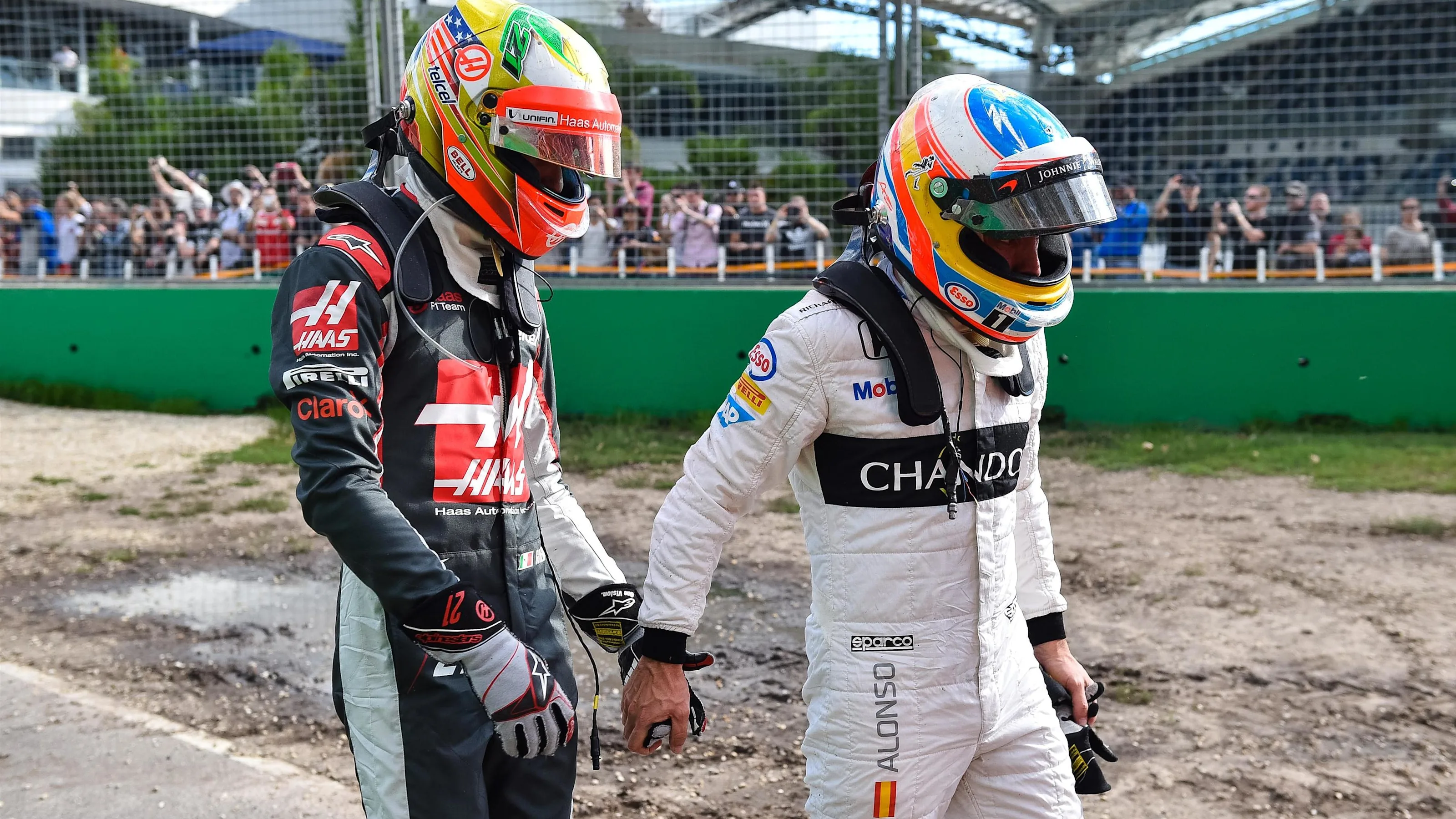 Fernando Alonso (ESP) McLaren and Esteban Gutierrez (MEX) Haas F1 crashed out of the race at