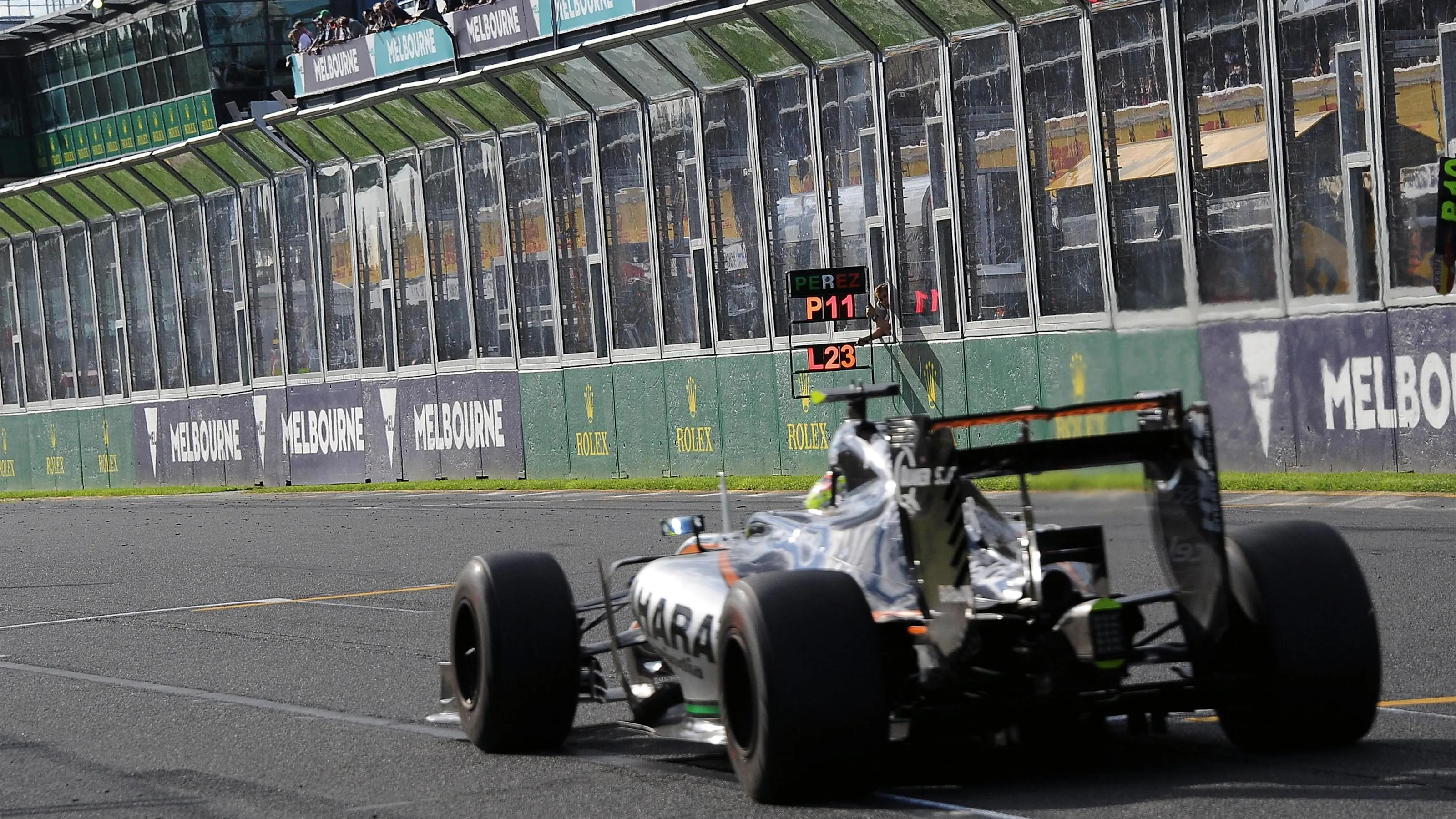 Sergio Perez (MEX) Force India VJM09 passes his pit board at Formula One World Championship, Rd1,