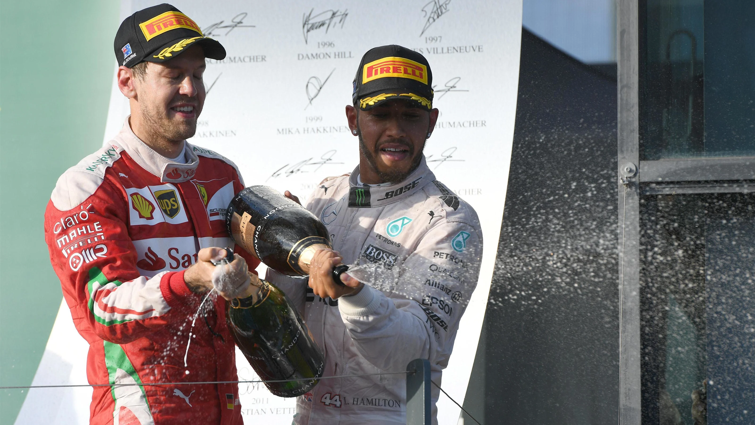 Sebastian Vettel (GER) Ferrari and Nico Rosberg (GER) Mercedes AMG F1 celebrate on the podium with