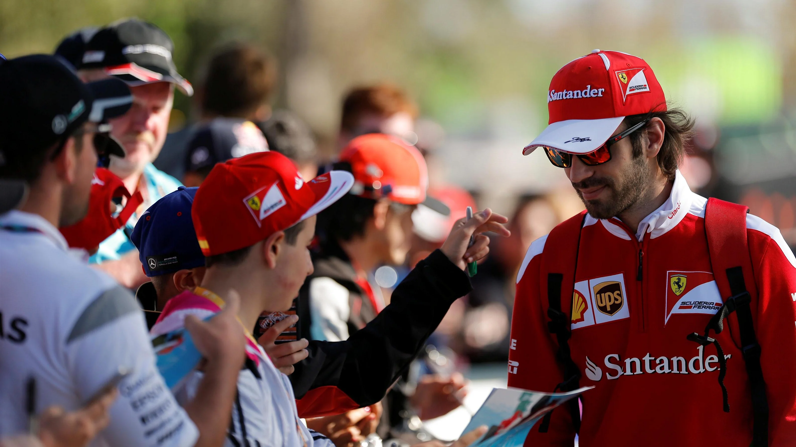 Jean-Eric Vergne (FRA) Ferrari Development Driver signs autographs for the fans at Formula One