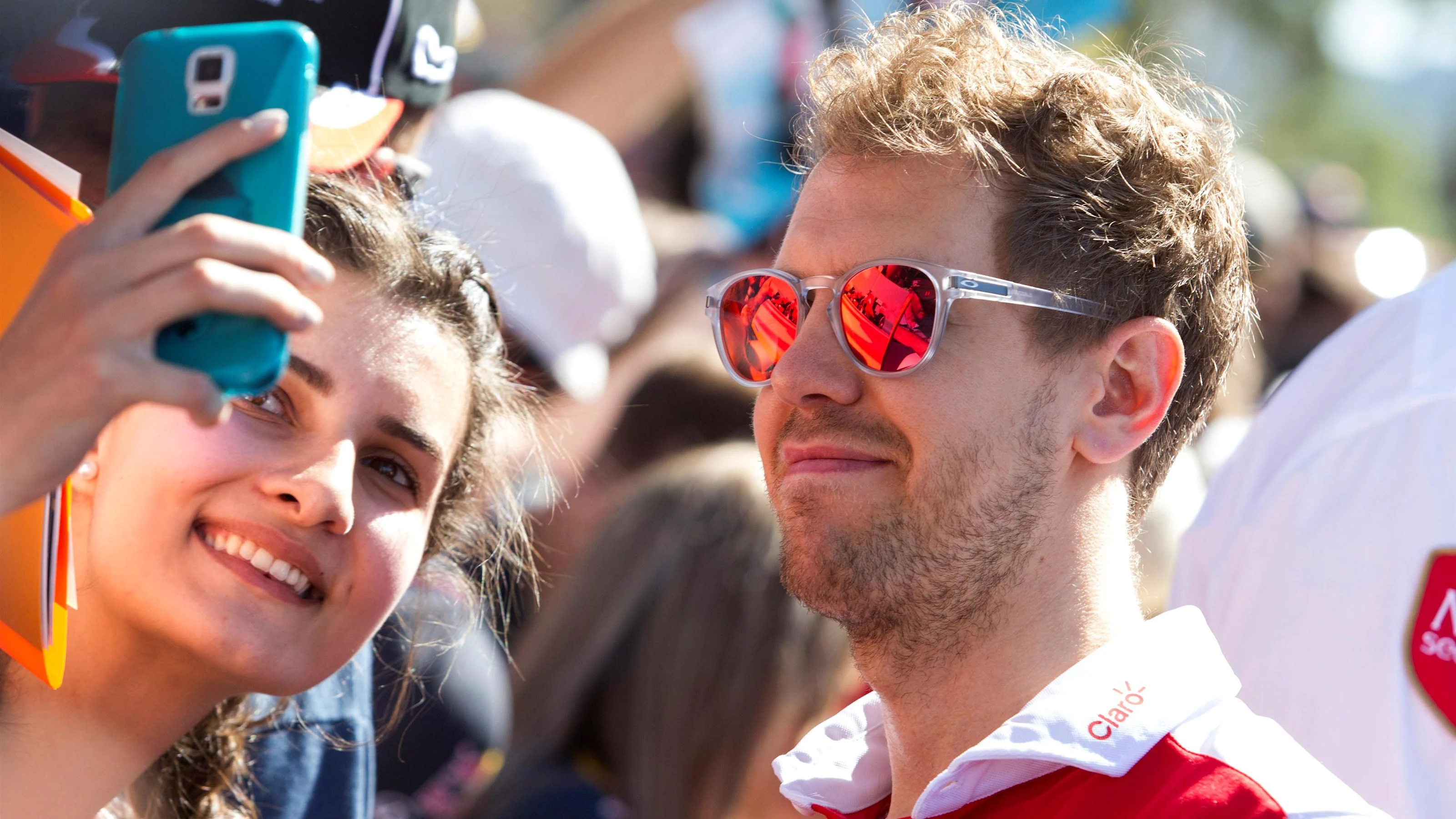 Sebastian Vettel (GER) Ferrari poses for a selfie with the fans at Formula One World Championship,