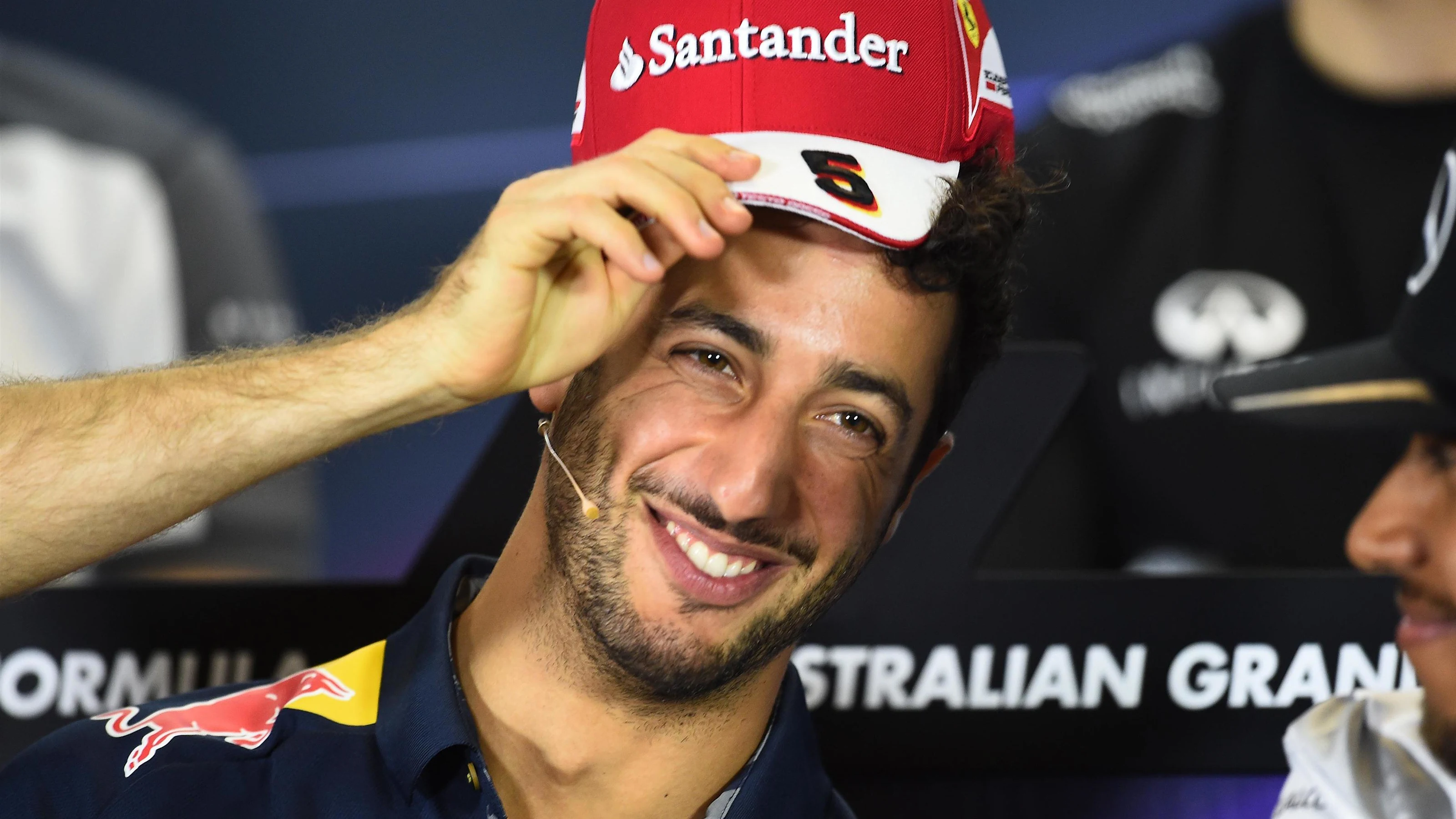 Daniel Ricciardo (AUS) Red Bull Racing with Ferrari cap in the Press Conference at Formula One