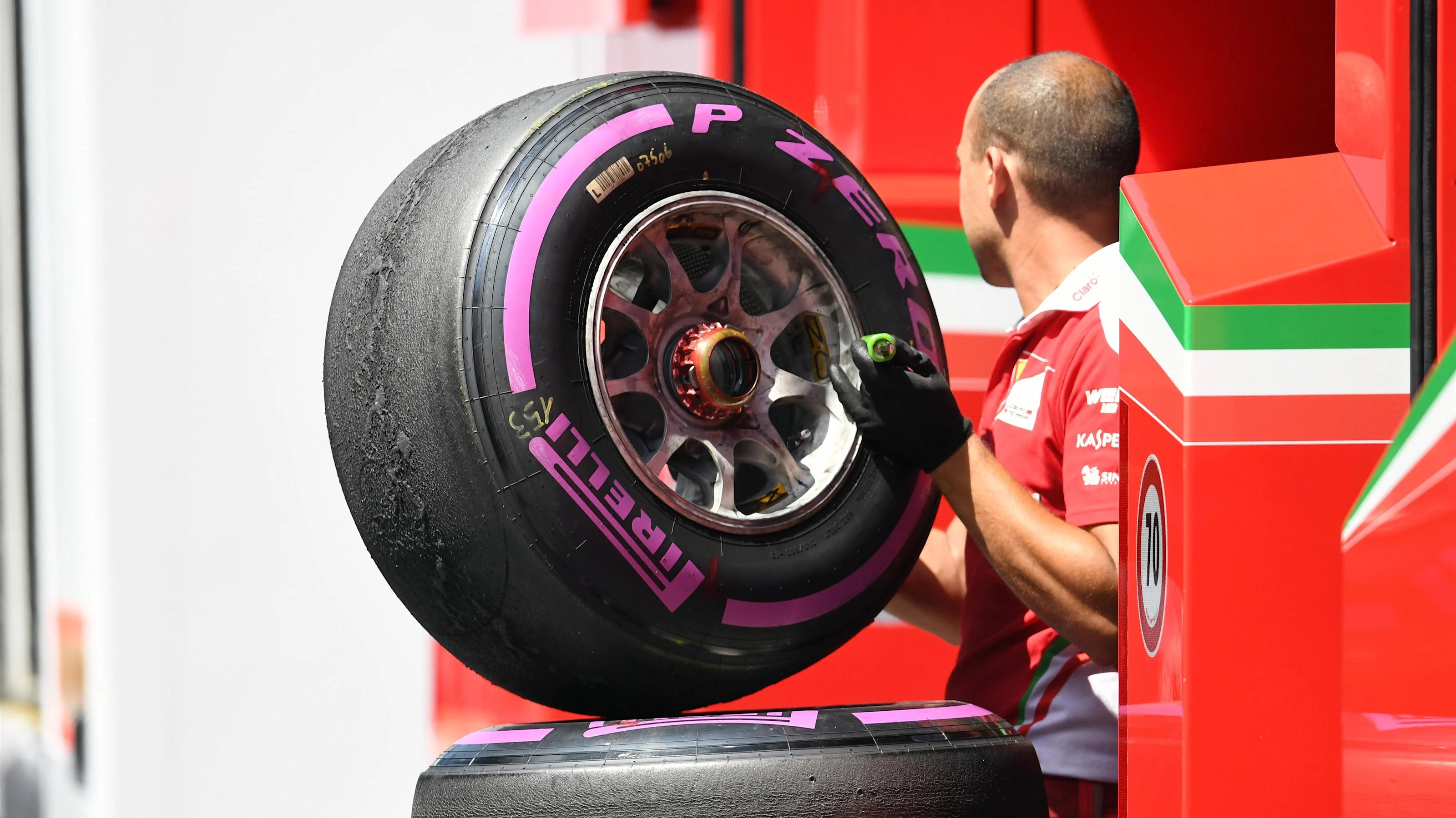 Ferrari mechanic and Pirelli tyre at Formula One World Championship, Rd9, Austrian Grand Prix,
