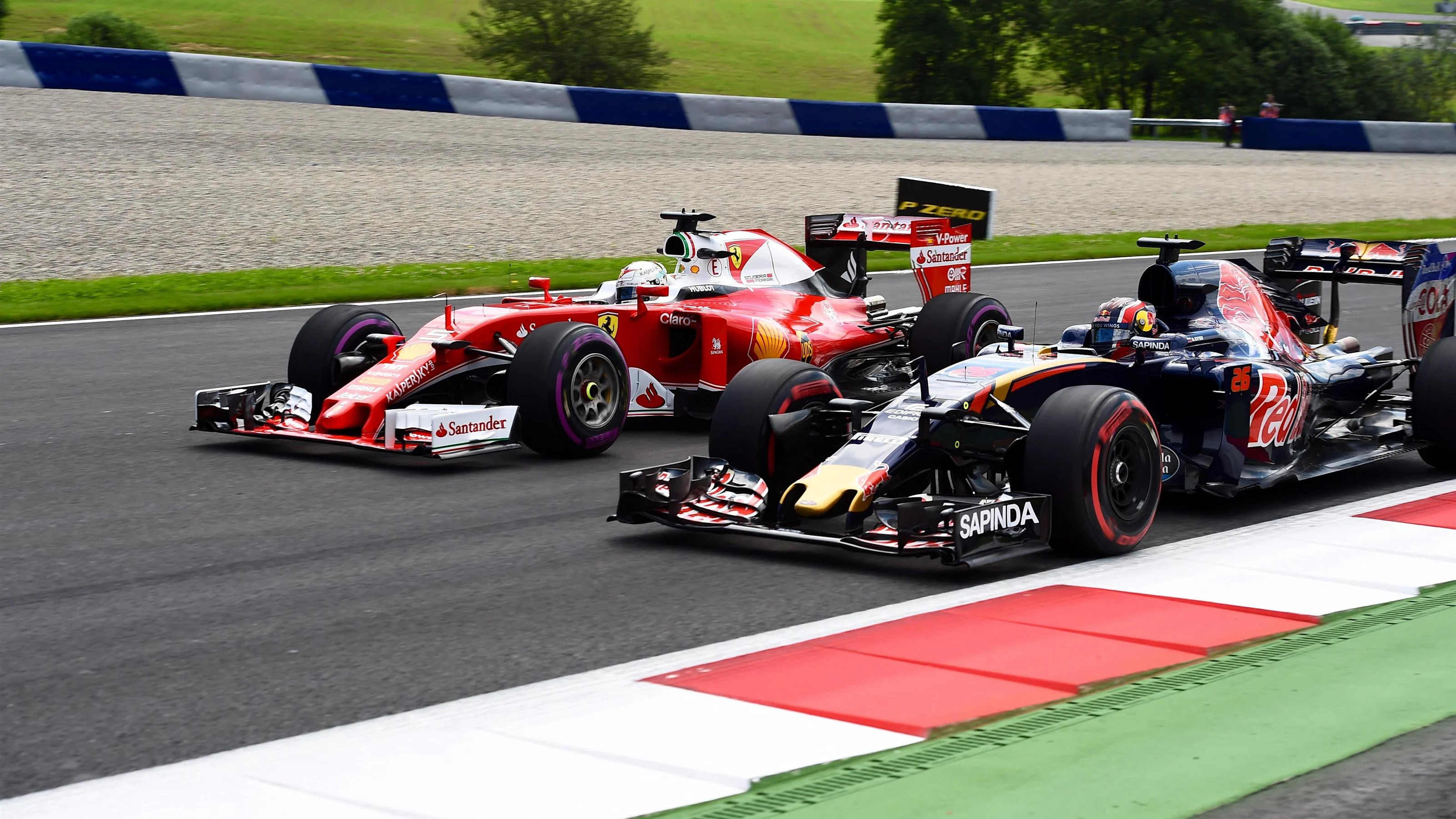 Sebastian Vettel (GER) Ferrari SF16-H and Daniil Kvyat (RUS) Scuderia Toro Rosso STR11 at Formula