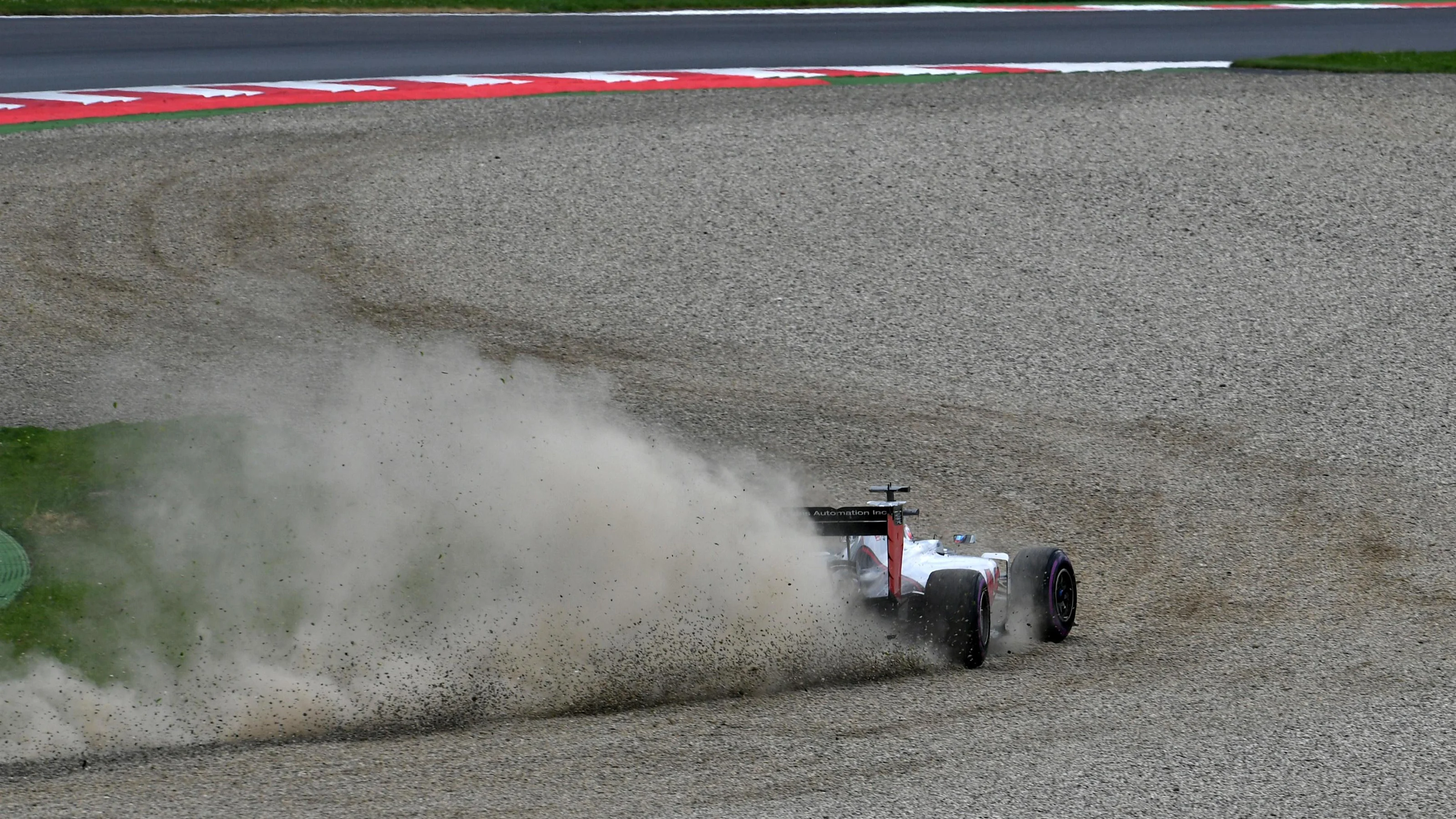 Romain Grosjean (FRA) Haas VF-16 runs through the gravel in Q2 at Formula One World Championship,