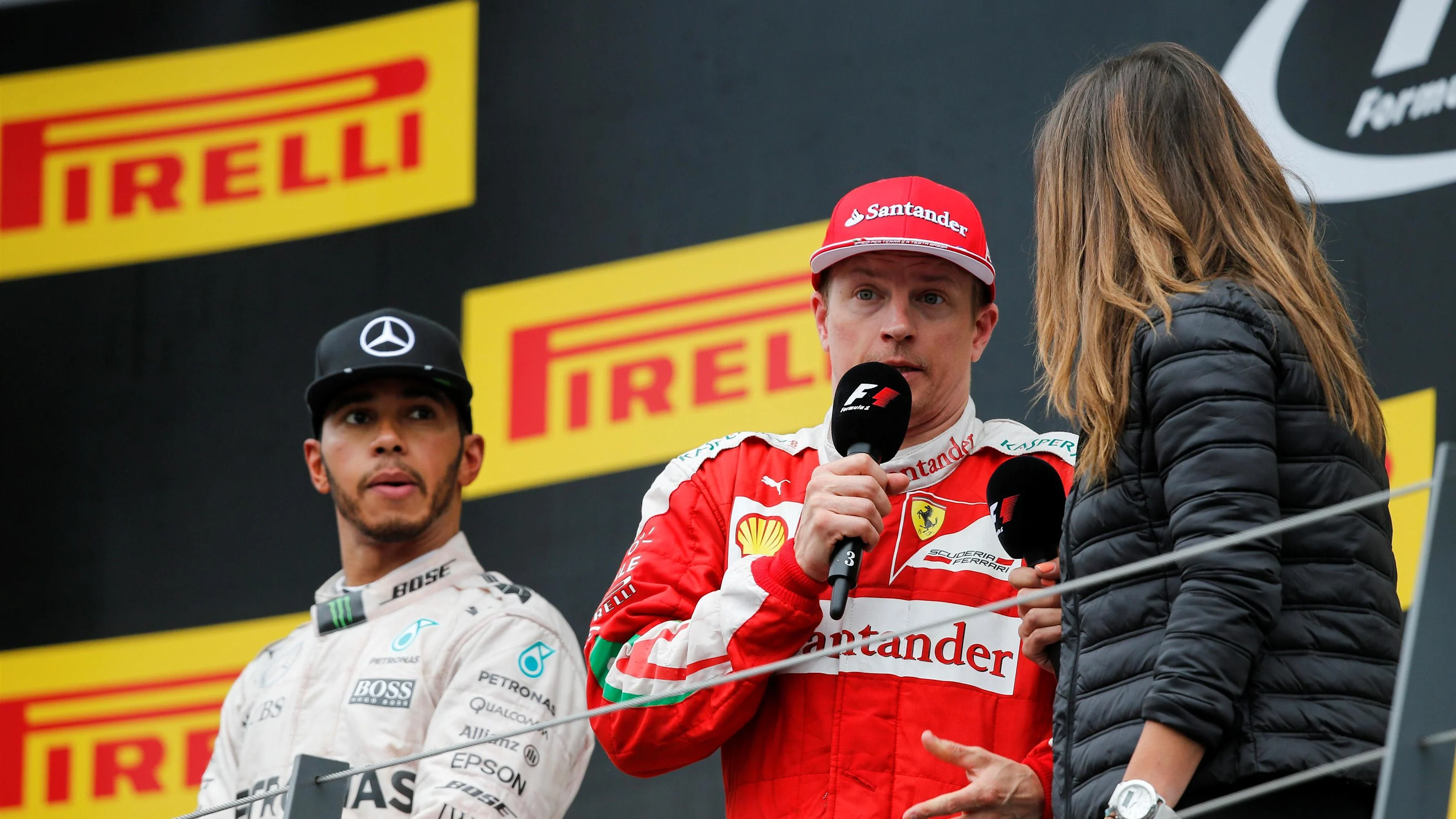 Lewis Hamilton (GBR) Mercedes AMG F1 and Kimi Raikkonen (FIN) Ferrari celebrate on the podium at