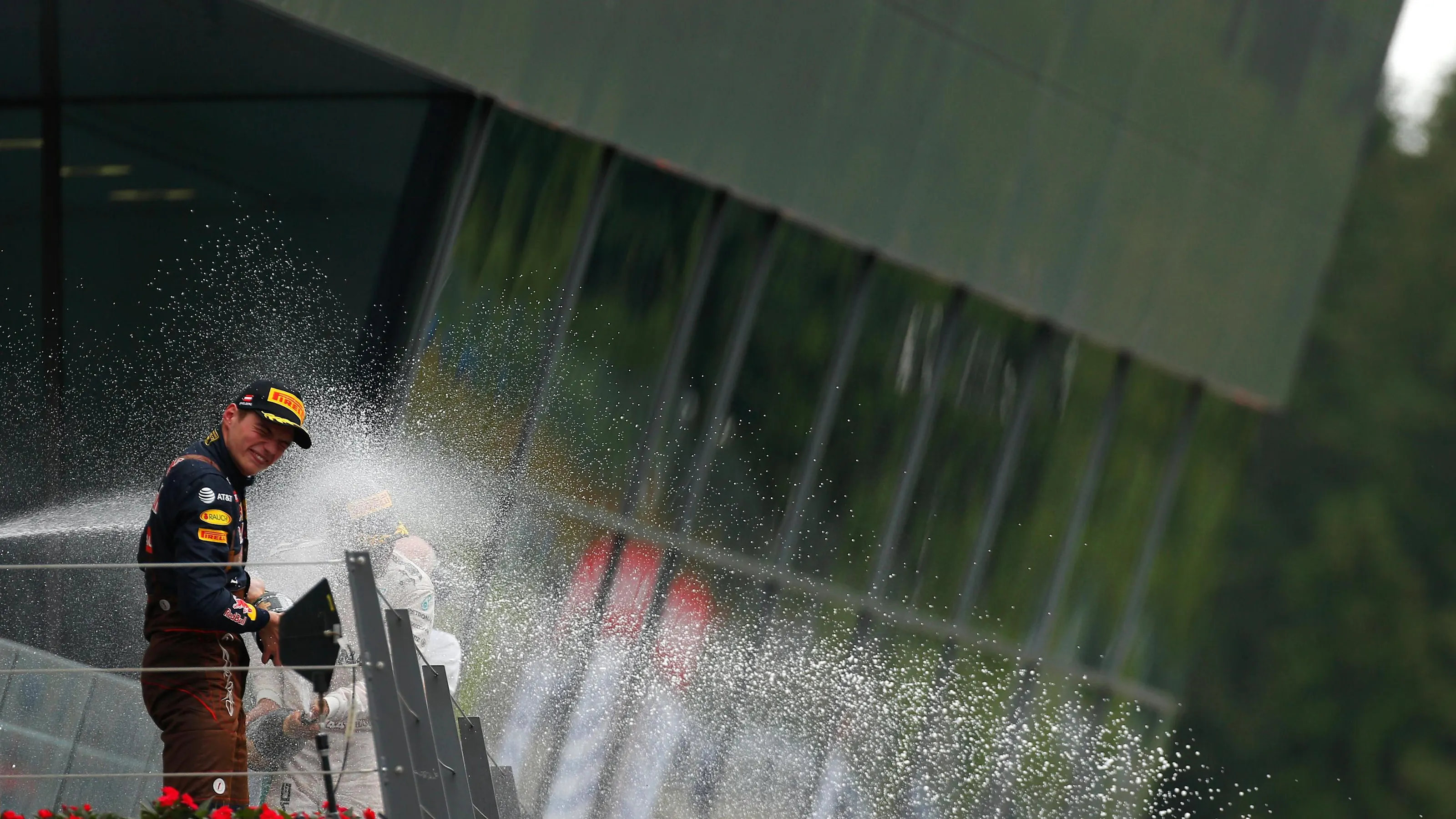 Max Verstappen (NED) Red Bull Racing celebrates on the podium with the champagne at Formula One