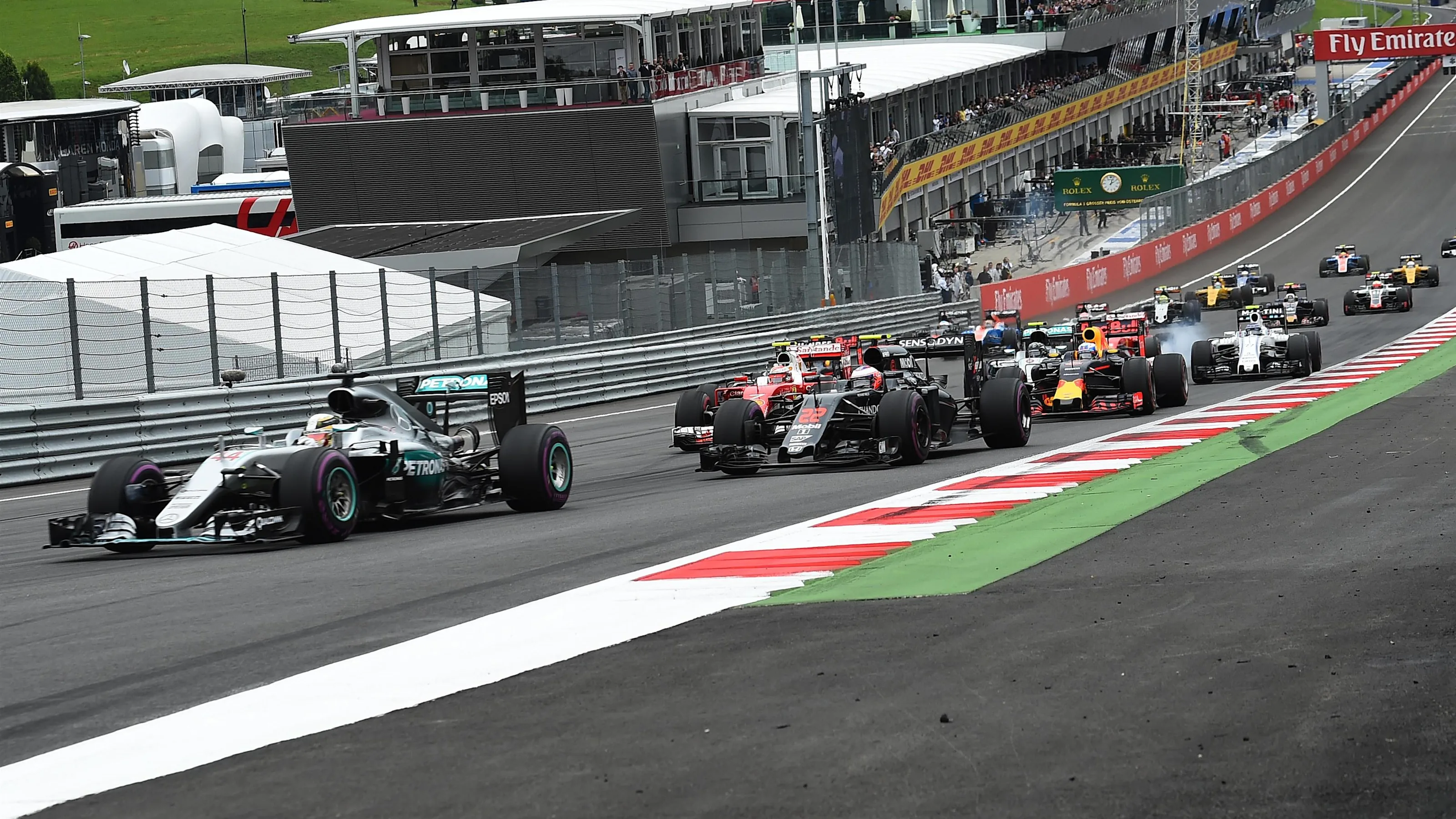 Lewis Hamilton (GBR) Mercedes-Benz F1 W07 Hybrid leads Jenson Button (GBR) McLaren MP4-31 at the
