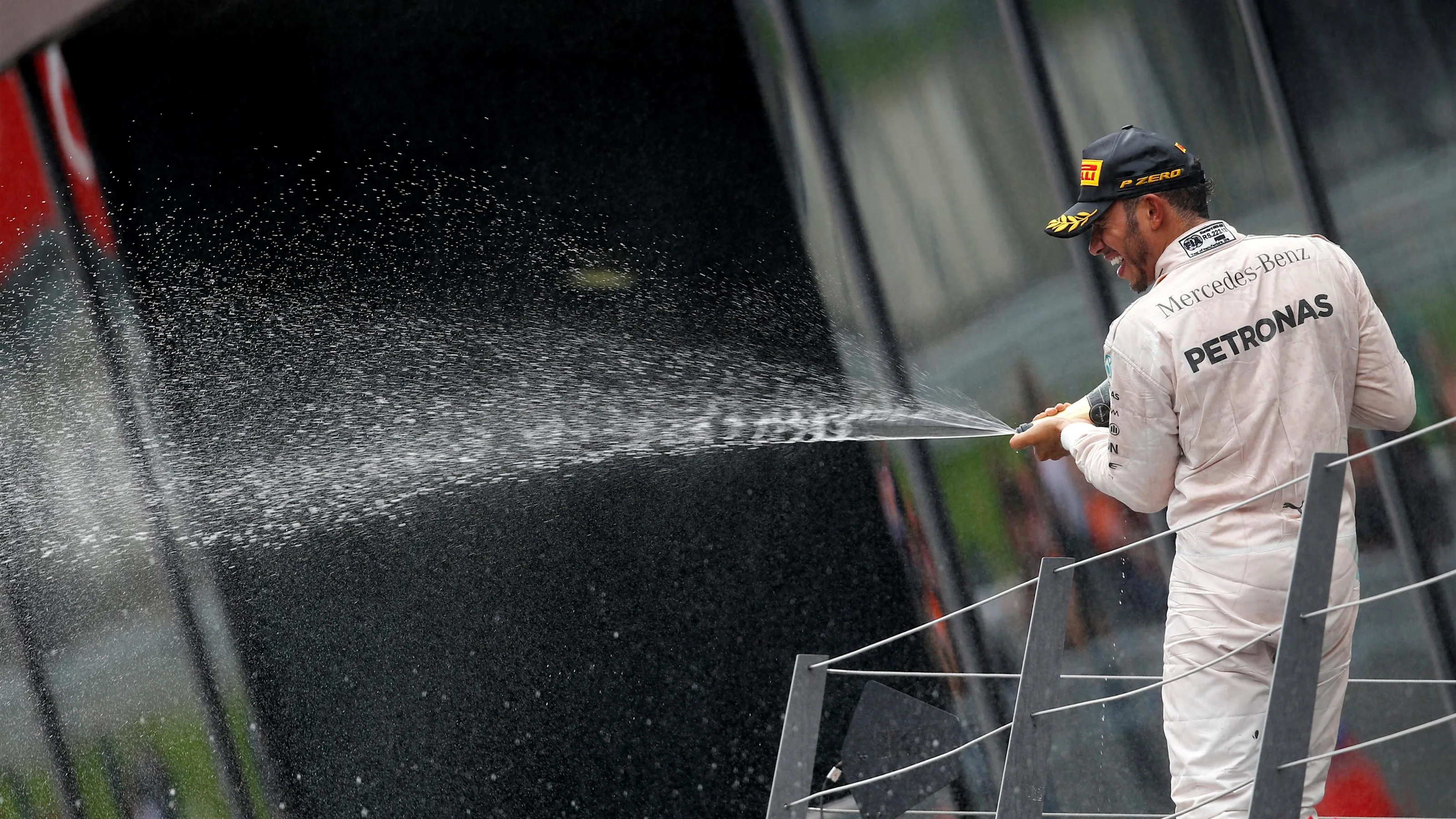 Lewis Hamilton (GBR) Mercedes-Benz F1 W07 Hybrid celebrates on the podium with the champagne at