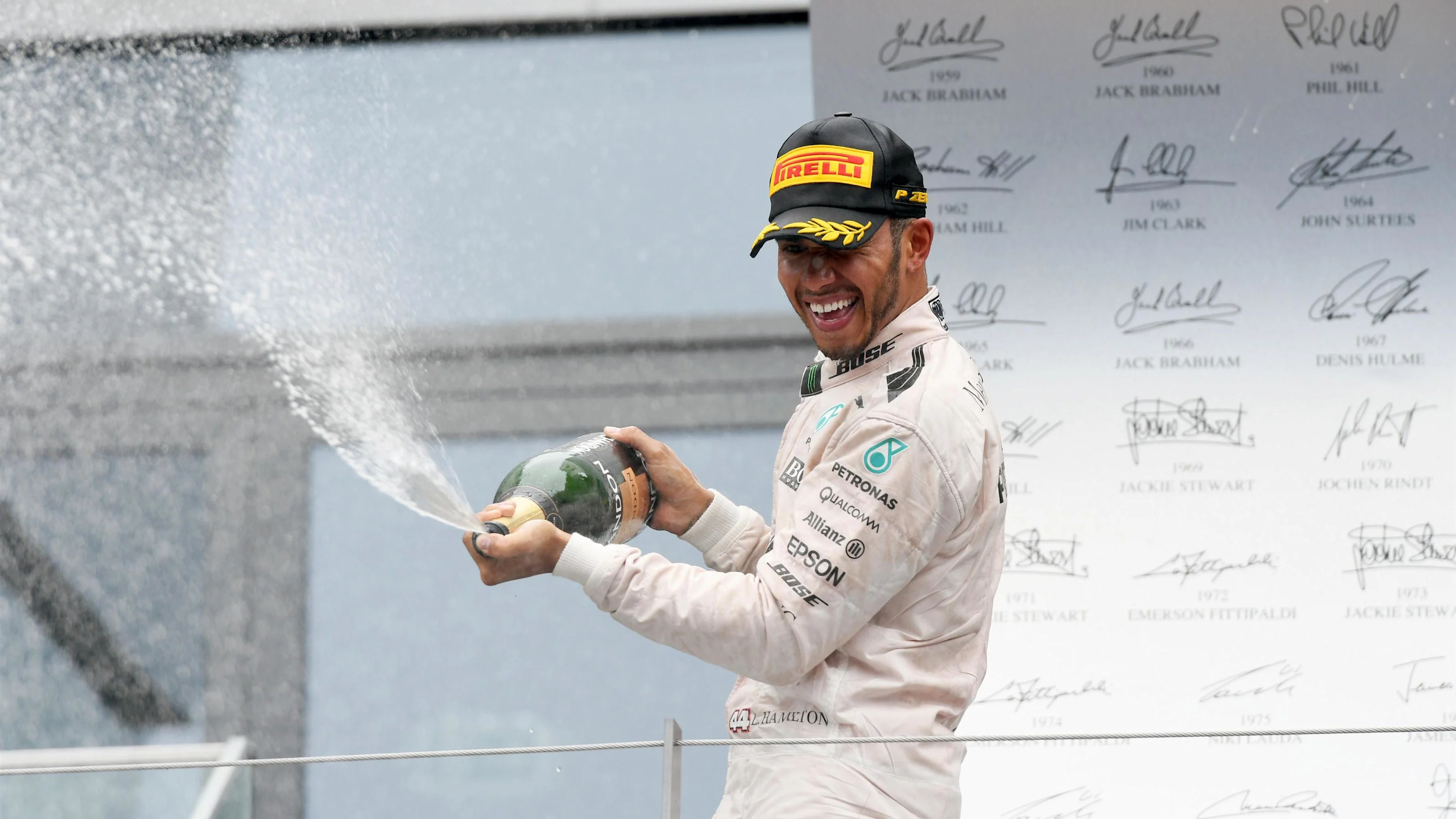 Race winner Lewis Hamilton (GBR) Mercedes AMG F1 celebrates on the podium with the champagne at