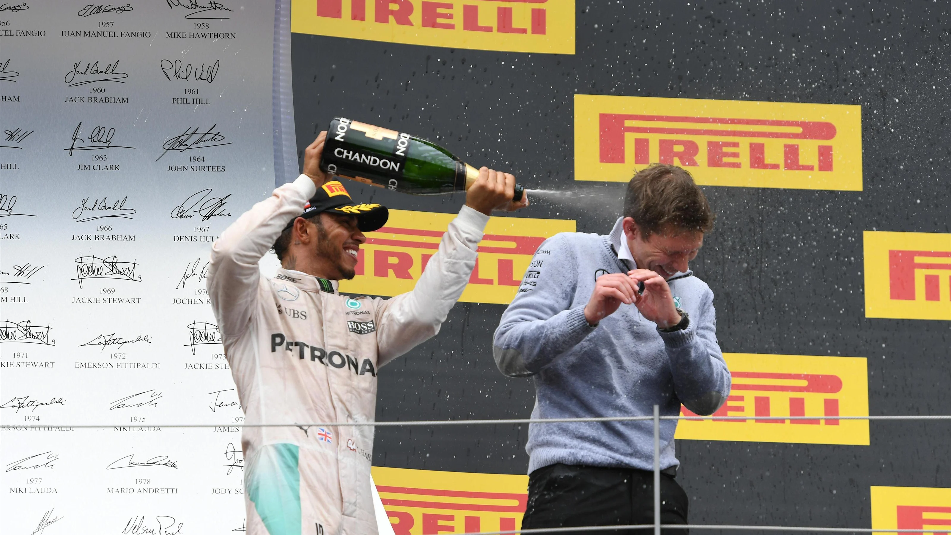 Race winner Lewis Hamilton (GBR) Mercedes AMG F1 celebrates on the podium with James Vowles (GBR)