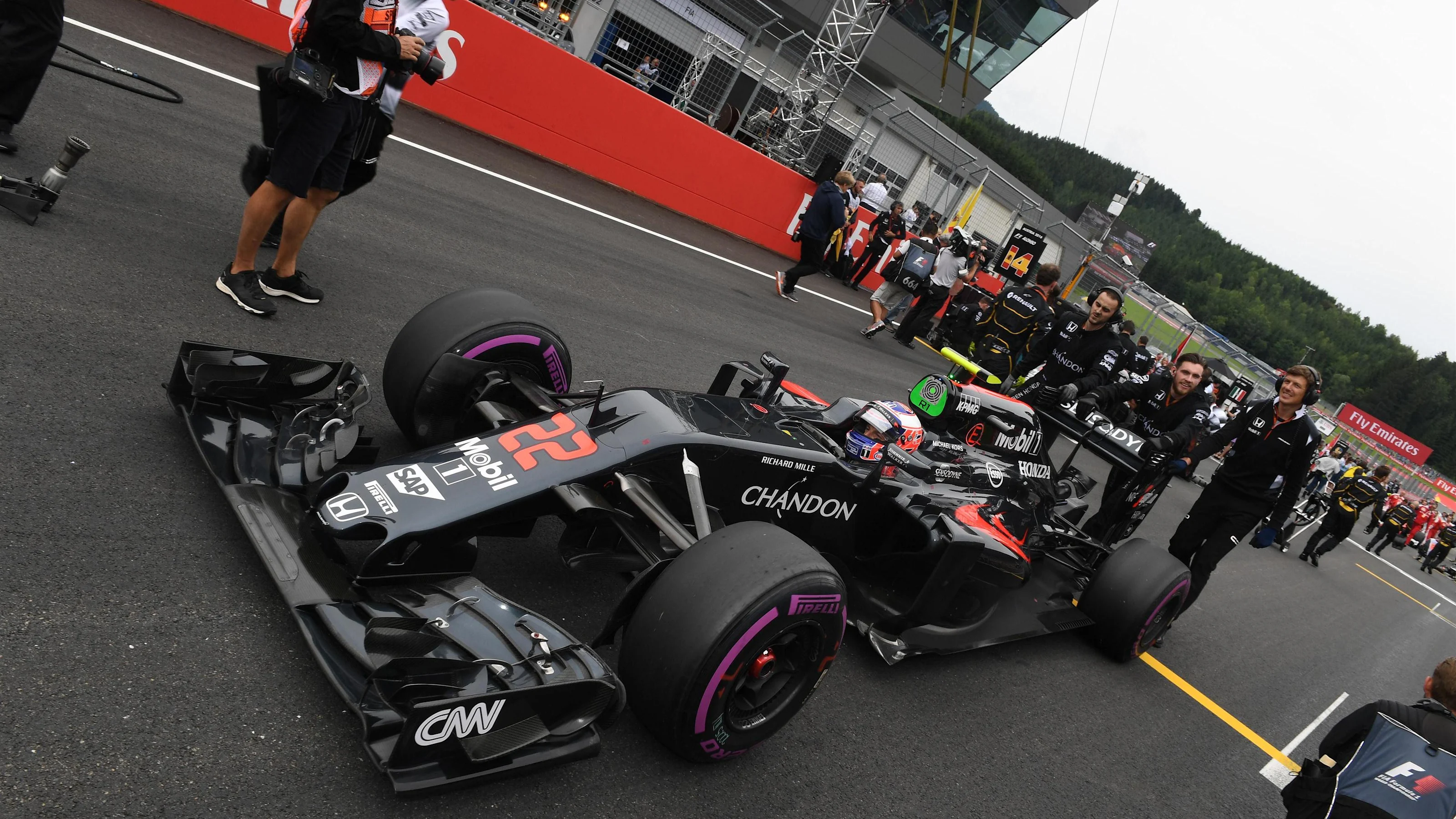 Jenson Button (GBR) McLaren MP4-31 on the grid at Formula One World Championship, Rd9, Austrian