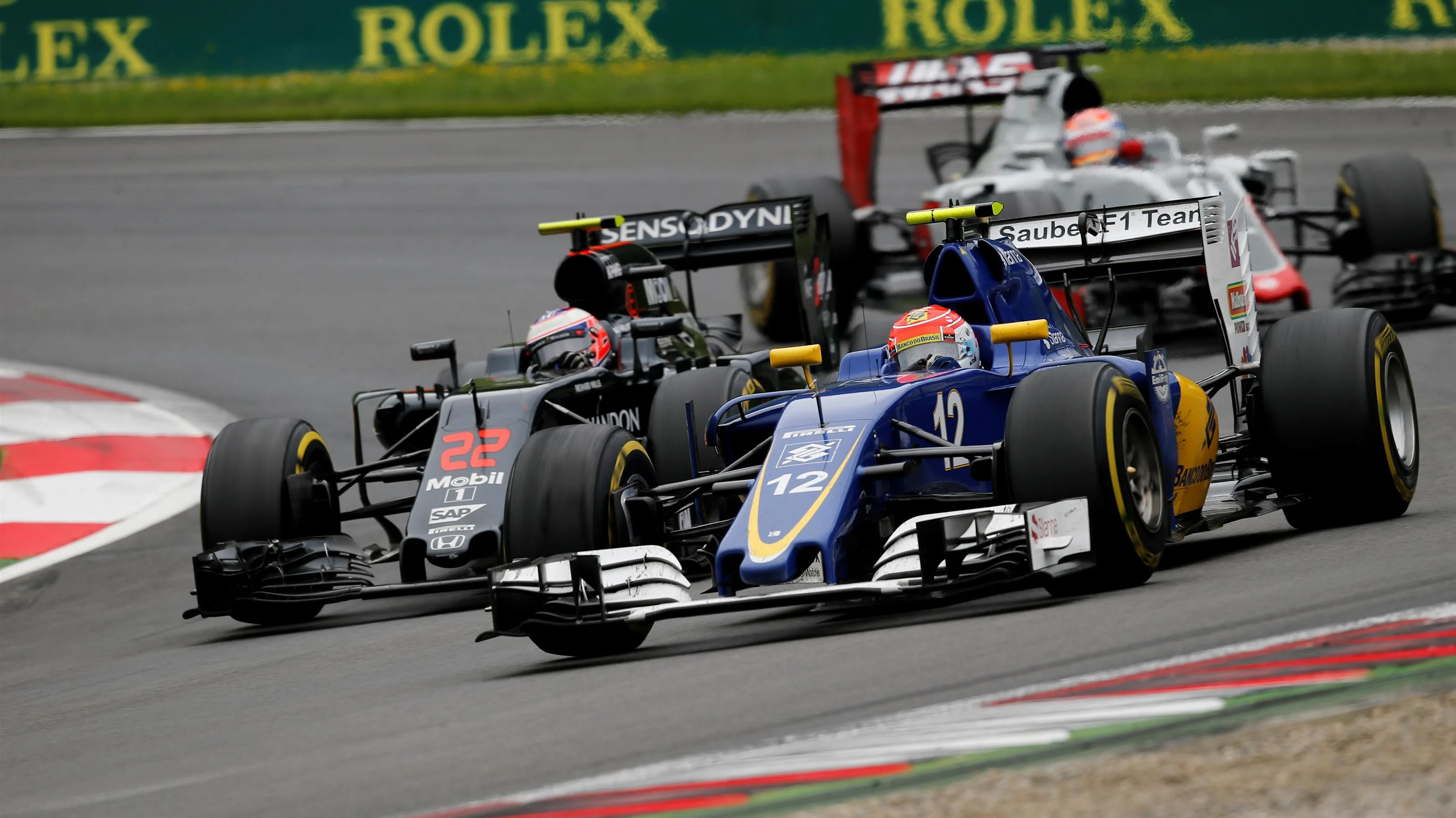Felipe Nasr (BRA) Sauber C35 and Jenson Button (GBR) McLaren MP4-31 battle at Formula One World