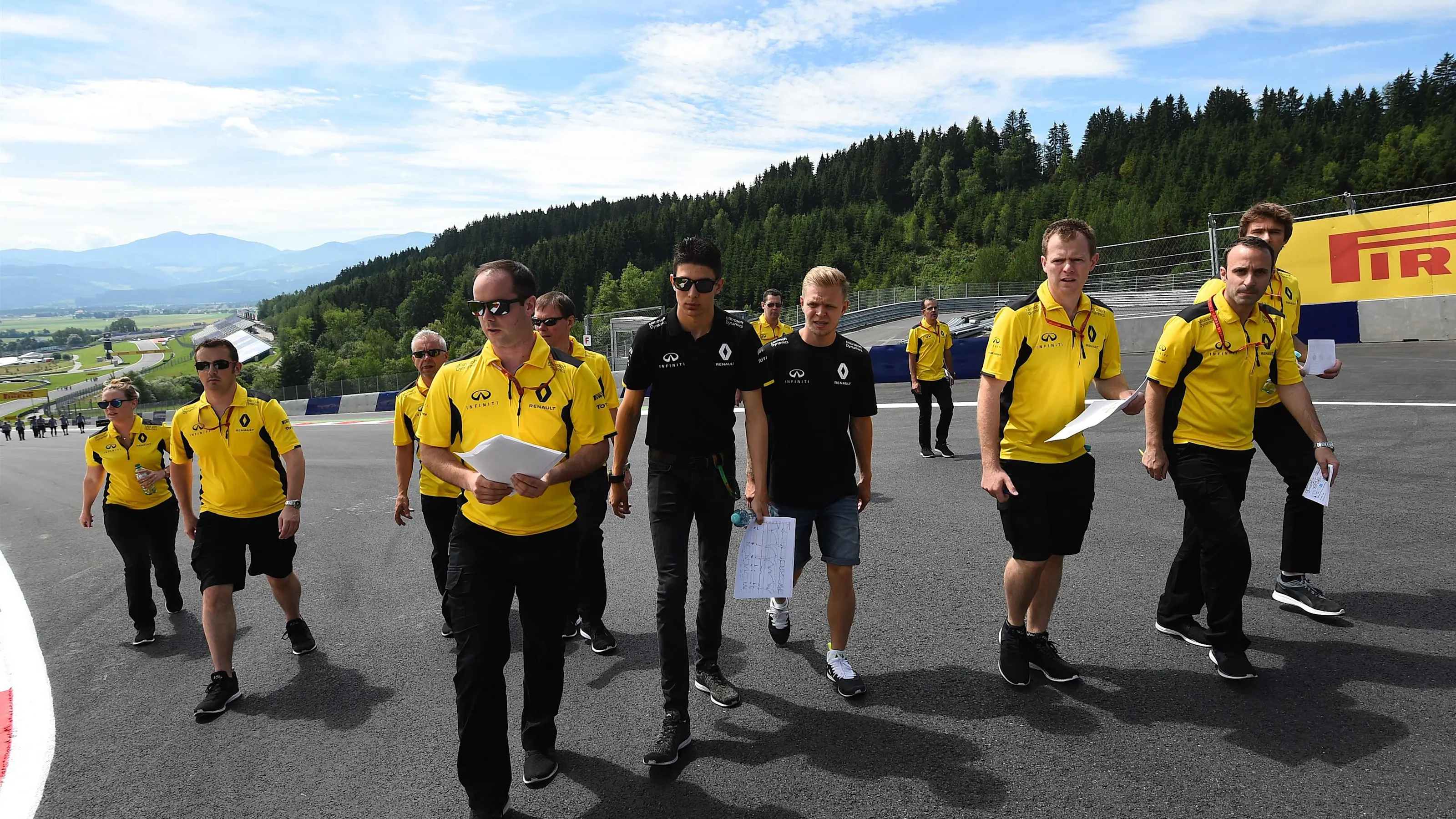 Esteban Ocon (FRA) Renault Sport F1 Team and Kevin Magnussen (DEN) Renault Sport F1 Team walk the