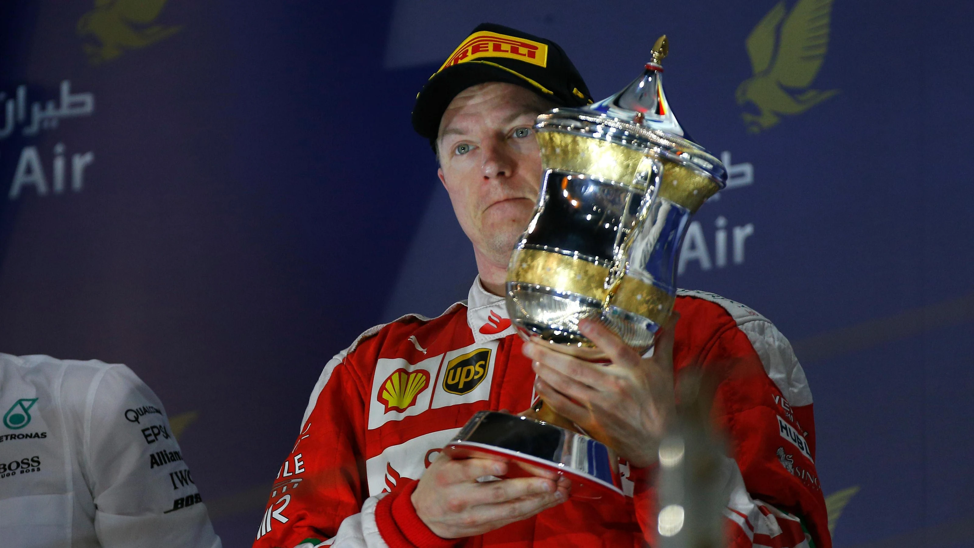 Kimi Raikkonen (FIN) Ferrari celebrates on the podium with the trophy at Formula One World