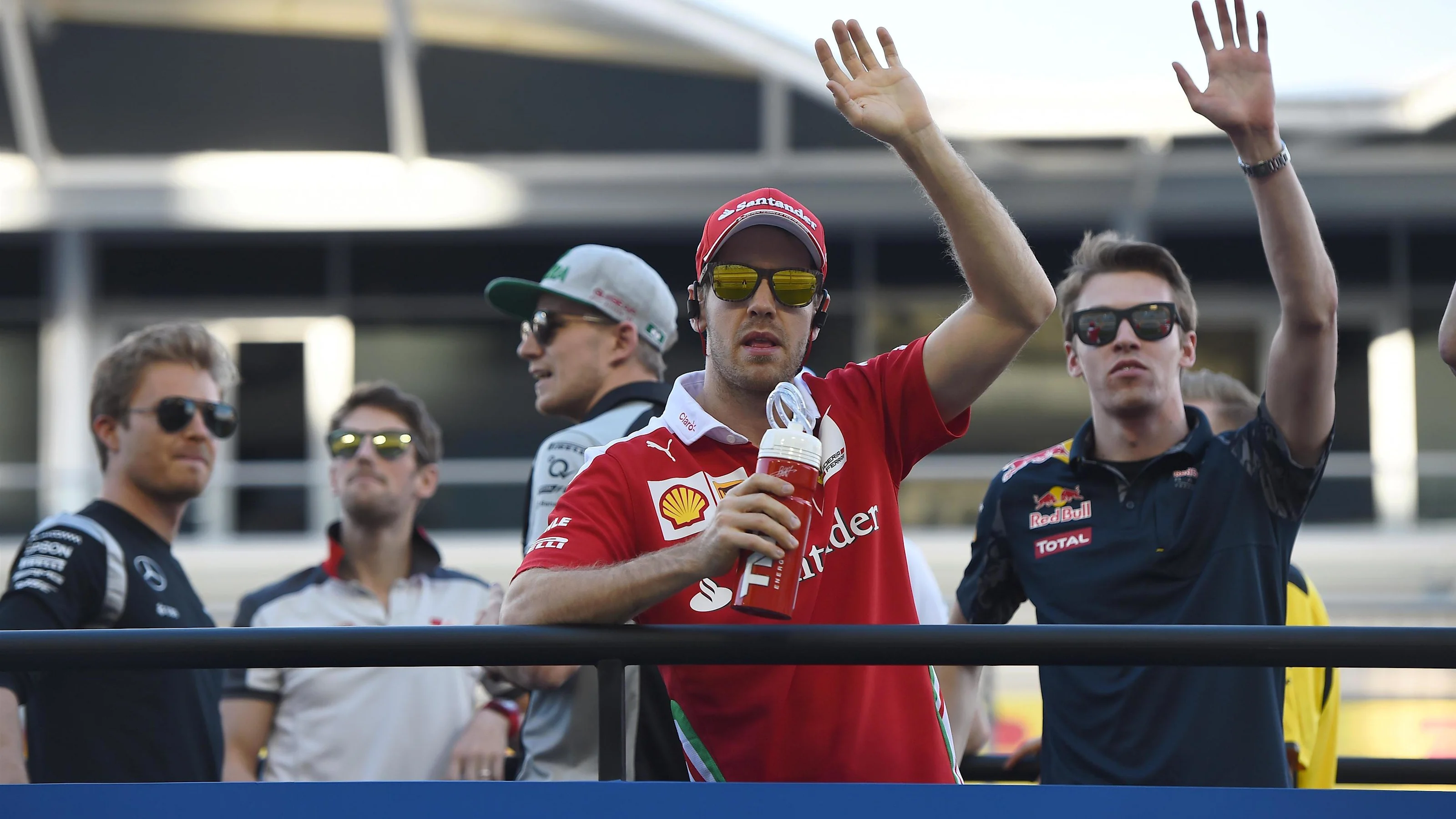 Sebastian Vettel (GER) Ferrari and Daniil Kvyat (RUS) Red Bull Racing on the drivers parade at