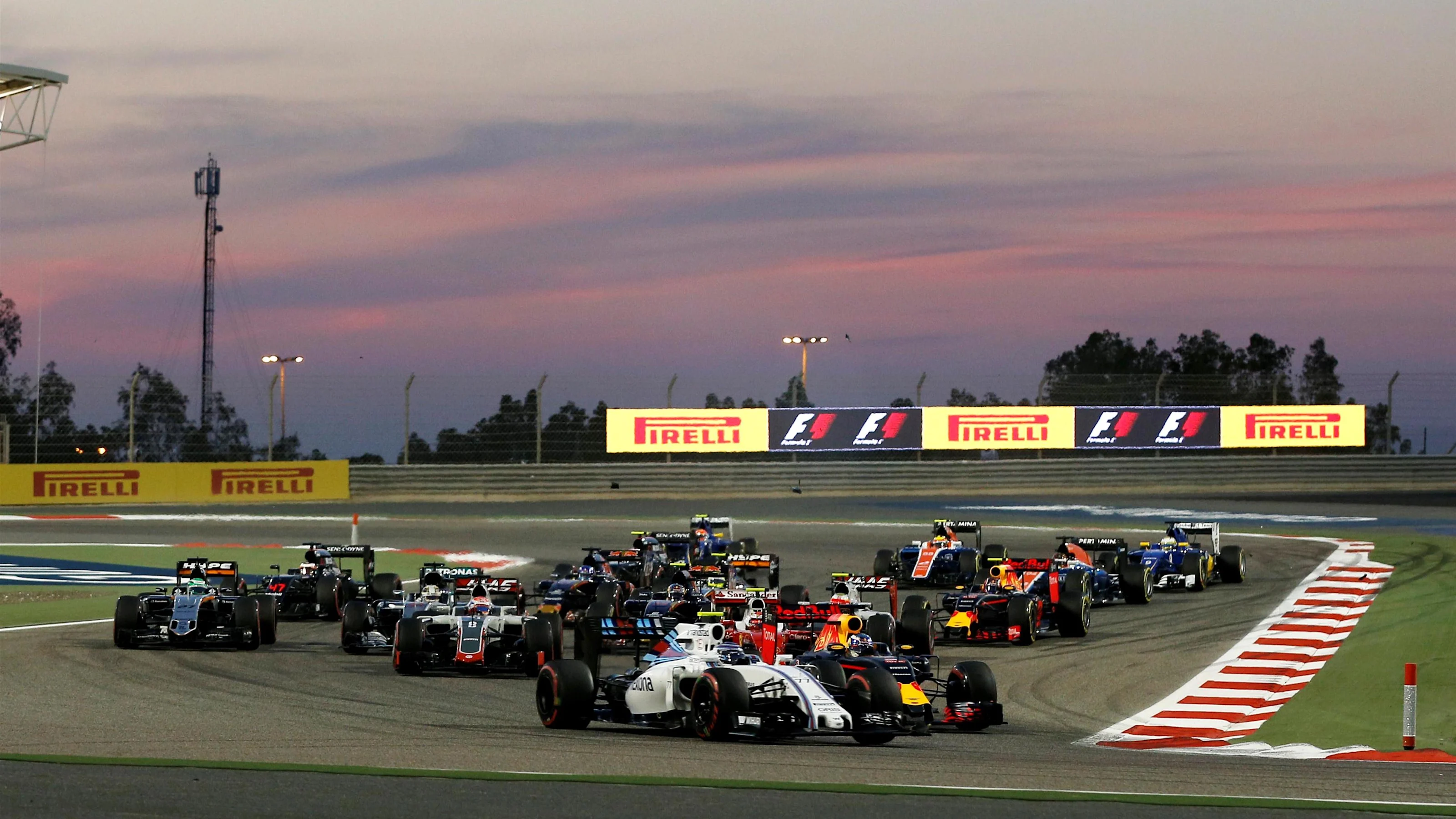 Valtteri Bottas (FIN) Williams FW38 and Daniel Ricciardo (AUS) Red Bull Racing RB12 at the start fo