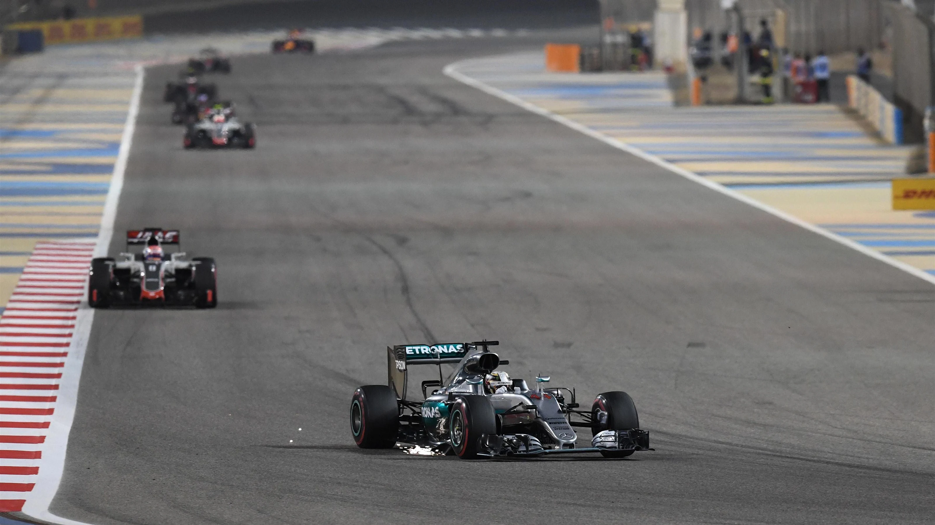 Lewis Hamilton (GBR) Mercedes-Benz F1 W07 Hybrid with damage sparks at Formula One World