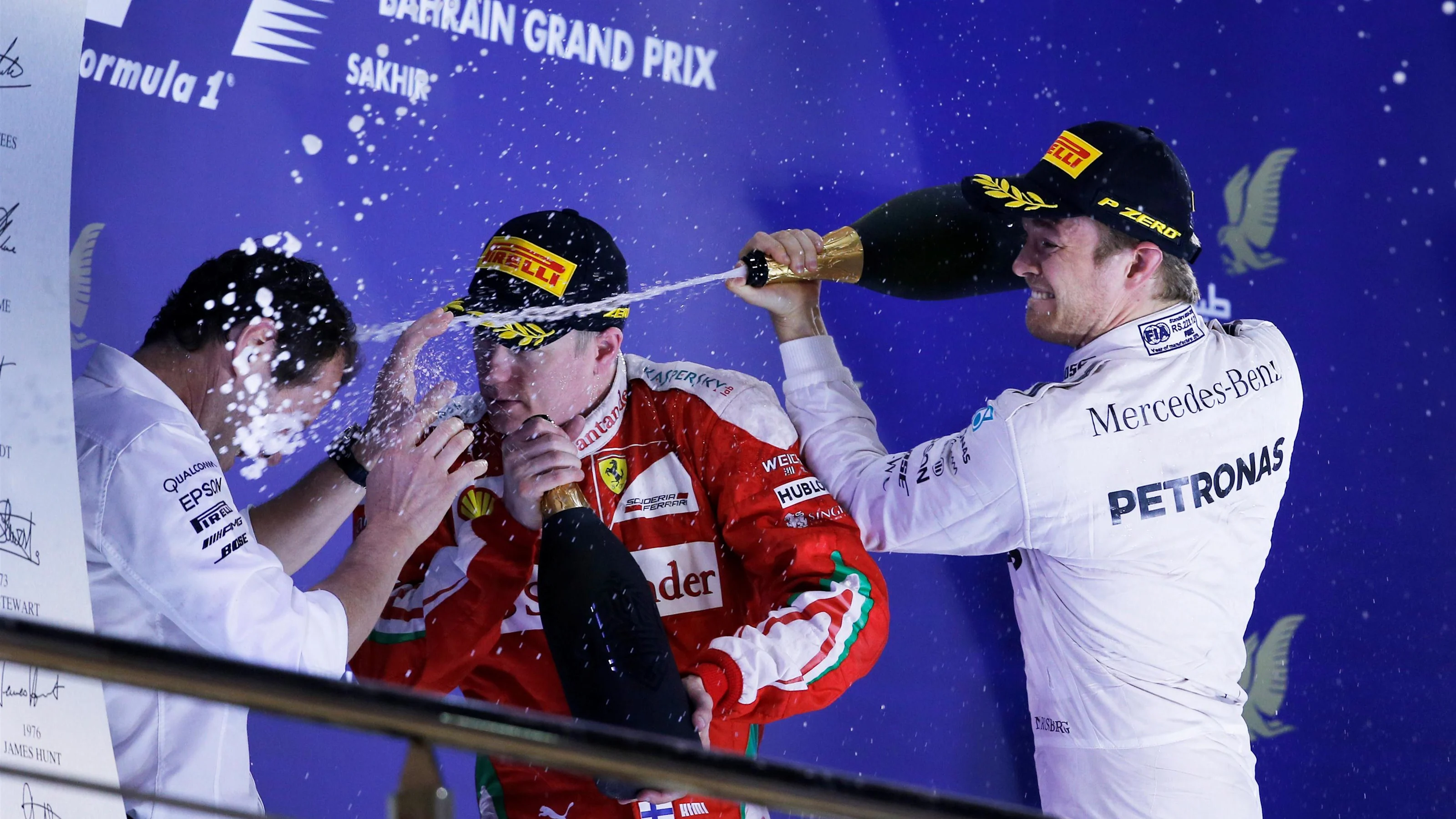 Race winner Nico Rosberg (GER) Mercedes AMG F1 celebrates on the podium with Kimi Raikkonen (FIN)