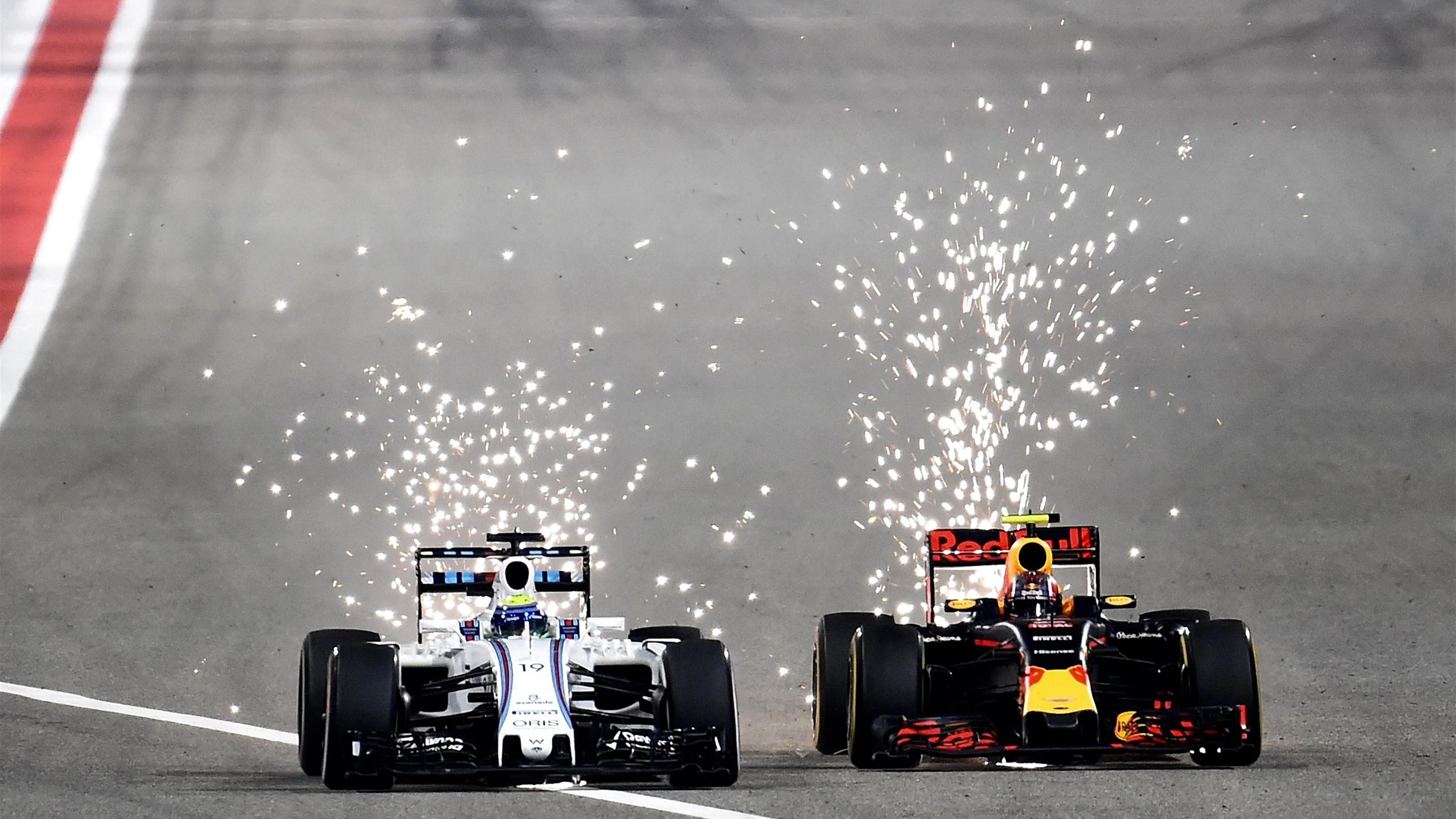 Felipe Massa (BRA) Williams FW38 and Daniil Kvyat (RUS) Red Bull Racing RB12 battle at Formula One