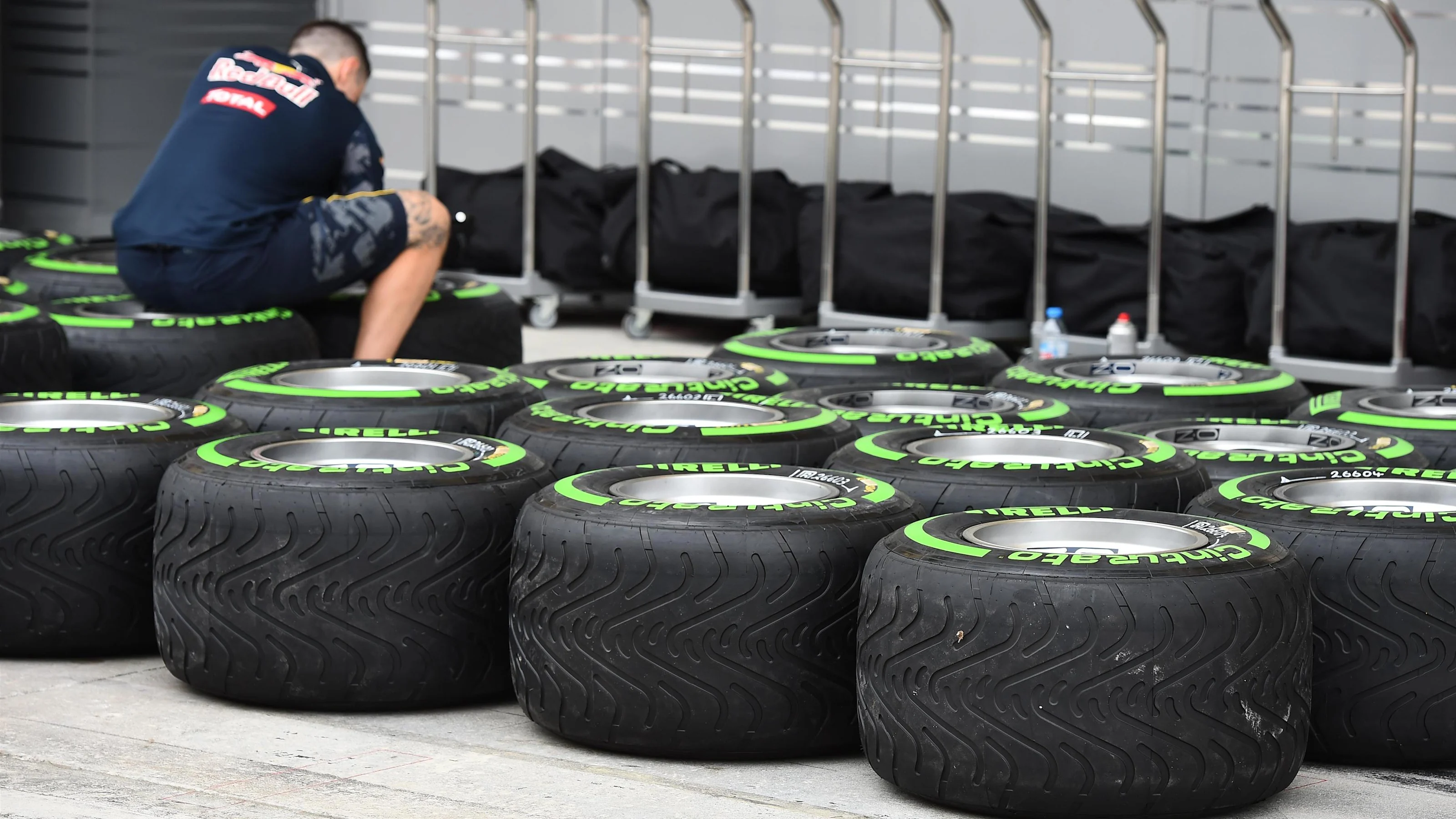 Red Bull Racing mechanic and Pirelli tyres at Formula One World Championship, Rd2, Bahrain Grand