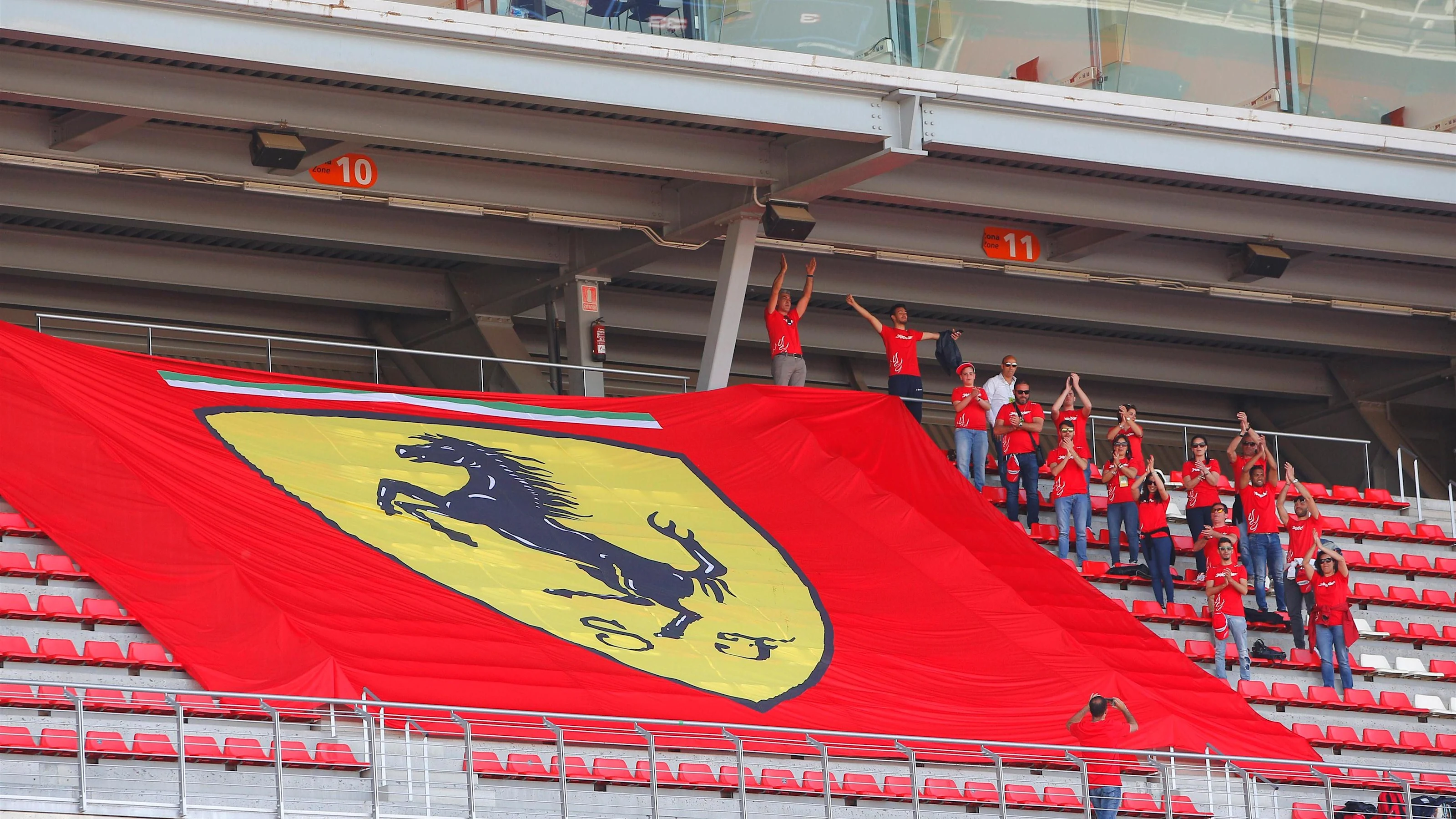 Ferrari fans and flags at Formula One Testing, Day Two, Barcelona, Spain, 18 May 2016.
