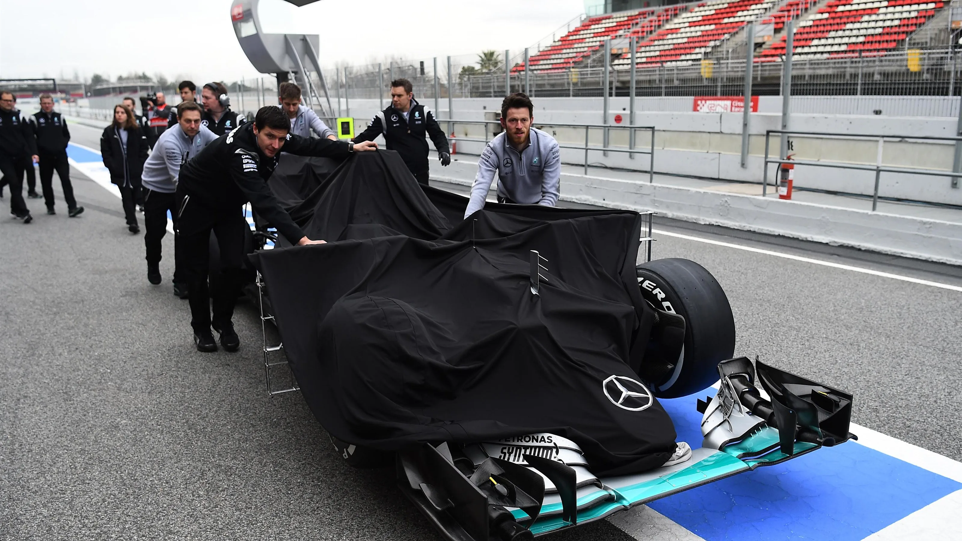 Mercedes AMG F1 mechanics with Mercedes-Benz F1 W07 Hybrid in pit lane at Formula One Testing, Day