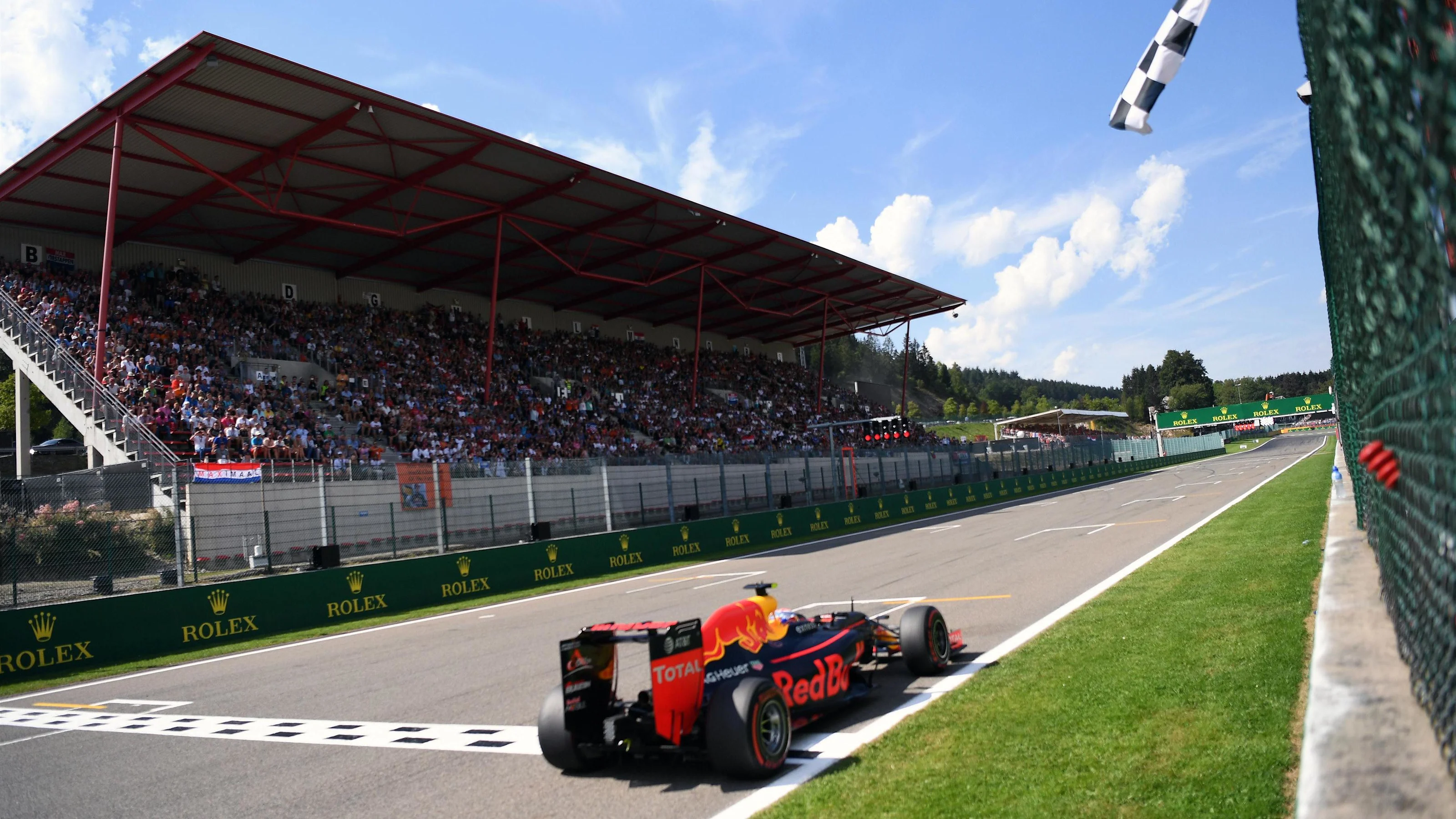 Max Verstappen (NED) Red Bull Racing RB12 takes the chequered flag at the end of Qualifying at