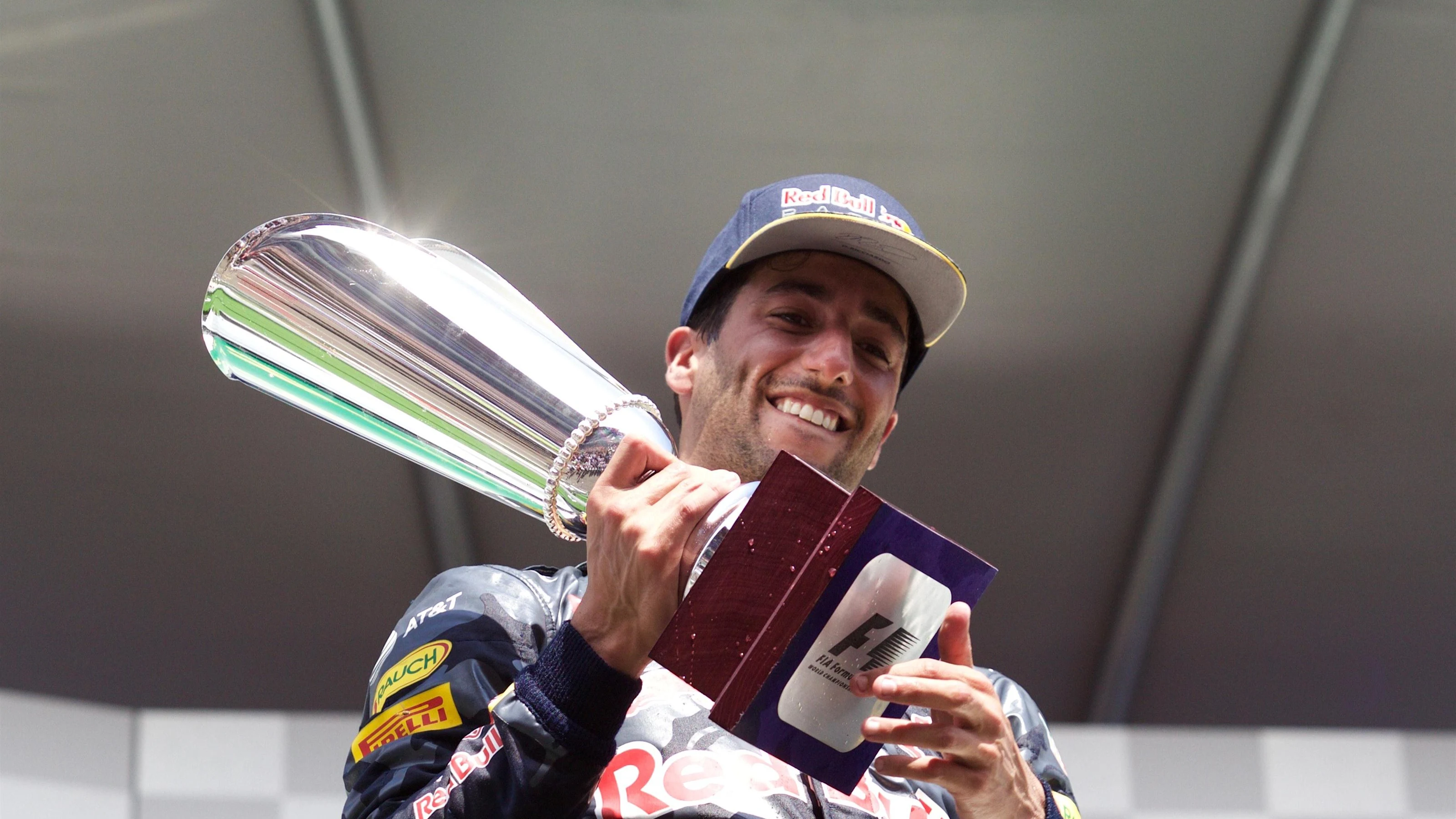 Daniel Ricciardo (AUS) Red Bull Racing celebrates on the podium with the trophy at Formula One