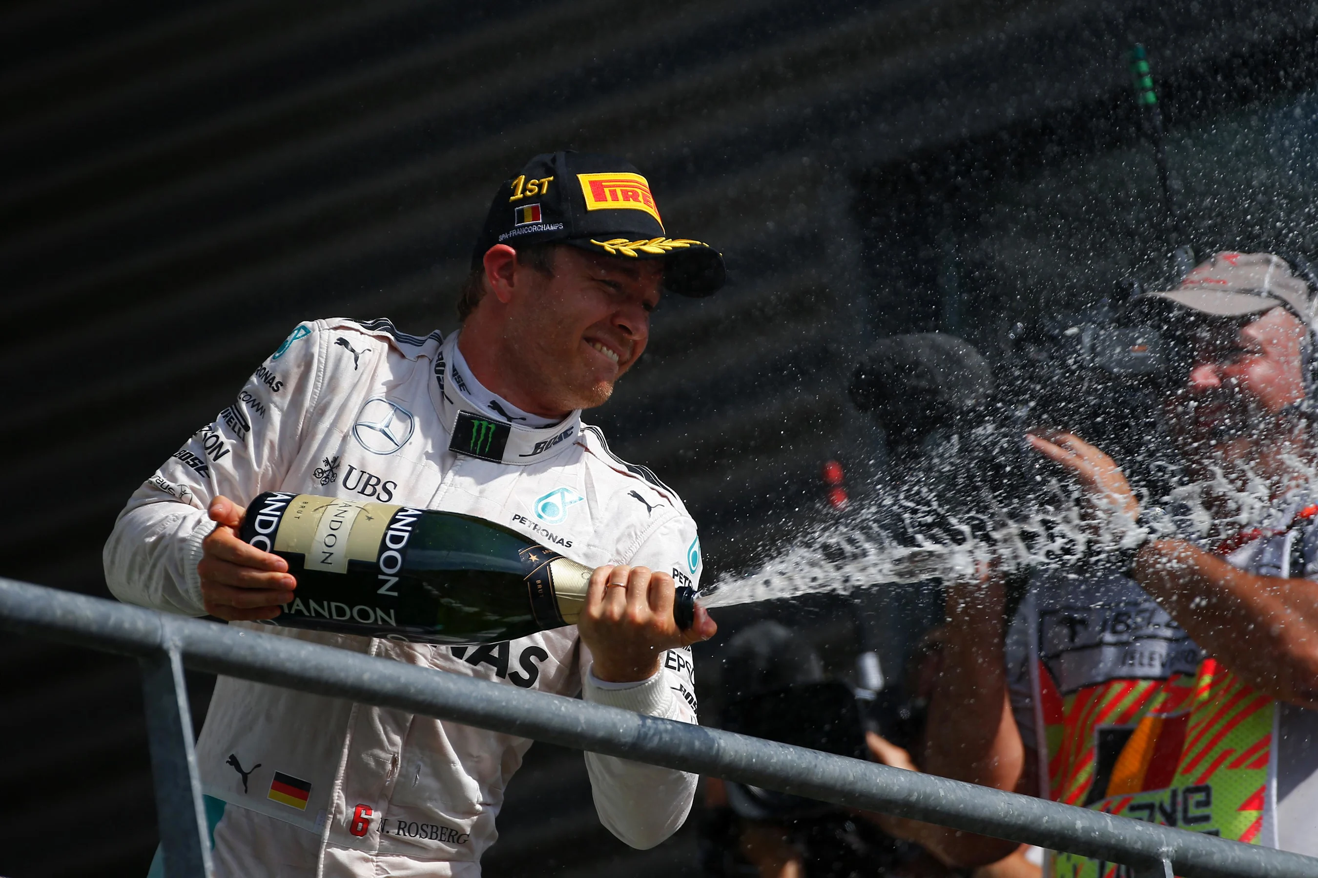 Race winner Nico Rosberg (GER) Mercedes AMG F1 celebrates on the podium with the champagne at
