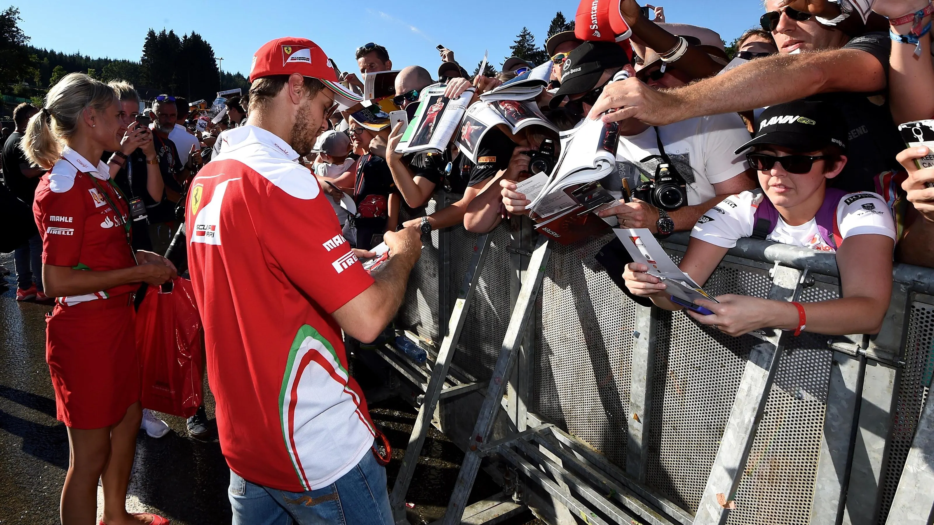 Sebastian Vettel (GER) Ferrari signs autographs for the fans at Formula One World Championship,