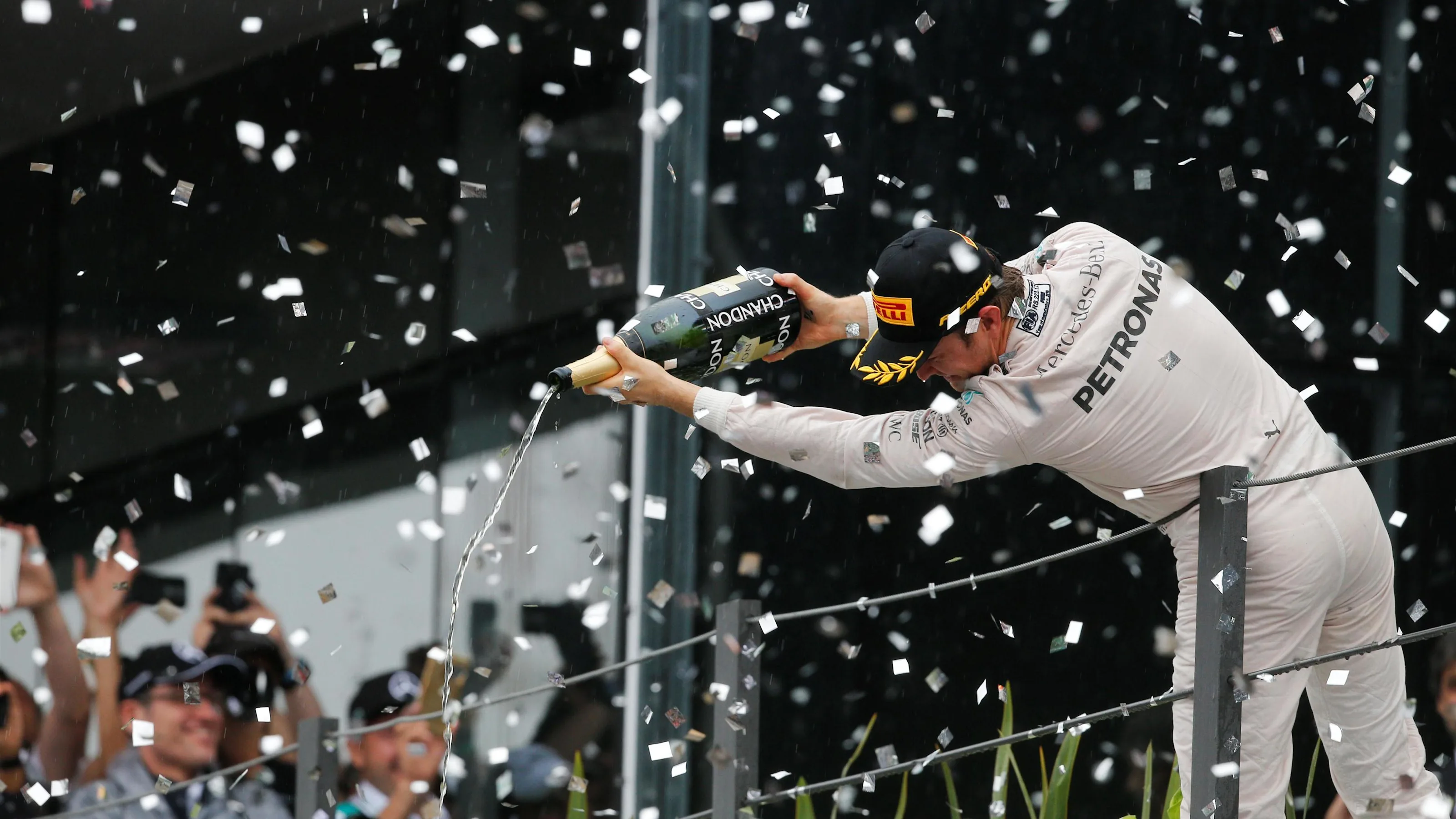 Nico Rosberg (GER) Mercedes AMG F1 celebrates with the champagne on the podium at Formula One World