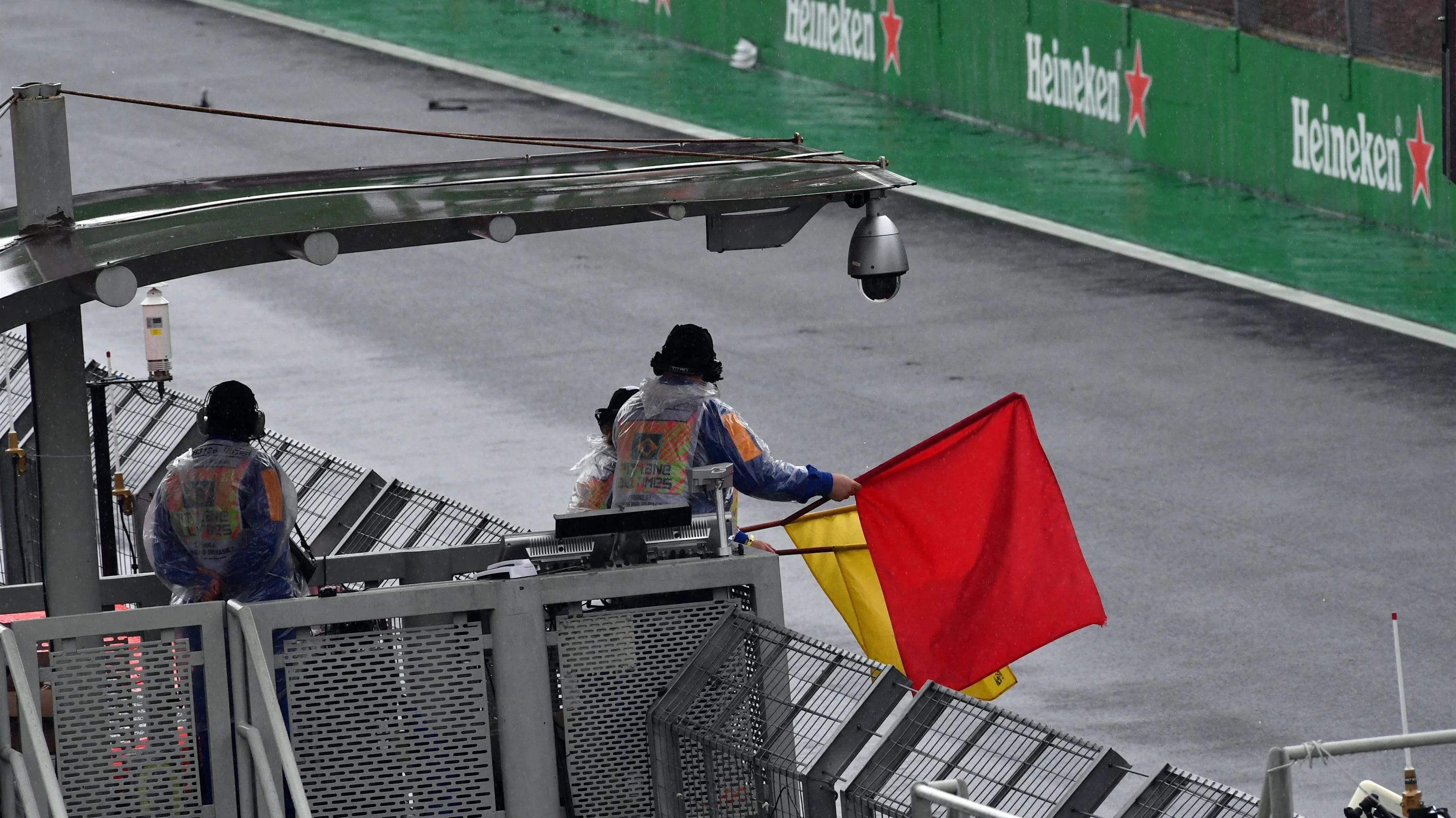 Marshal waves the Red Flag at Formula One World Championship, Rd20, Brazilian Grand Prix, Race,