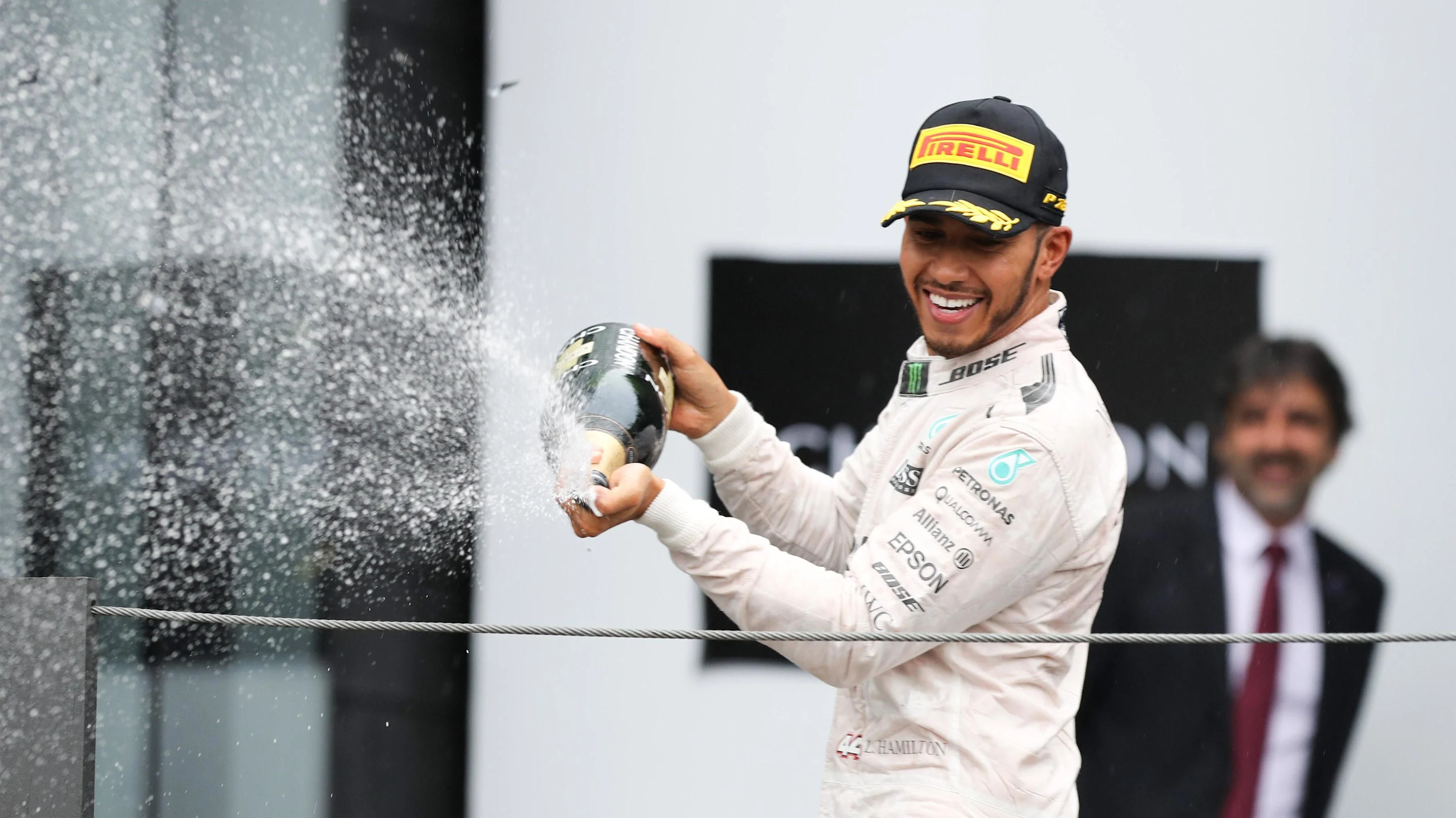 Lewis Hamilton (GBR) Mercedes AMG F1 celebrates with the champagne on the podium at Formula One