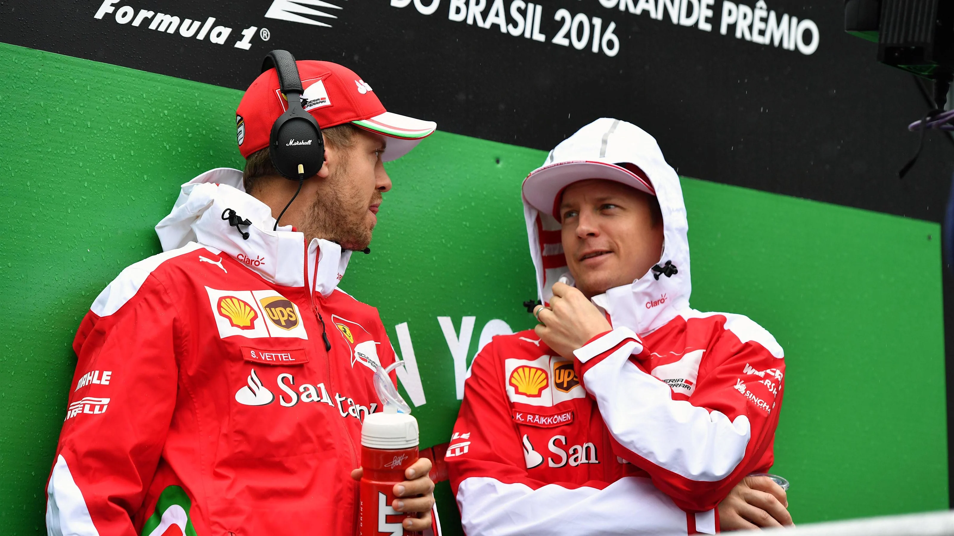Sebastian Vettel (GER) Ferrari and Kimi Raikkonen (FIN) Ferrari on the drivers parade at Formula