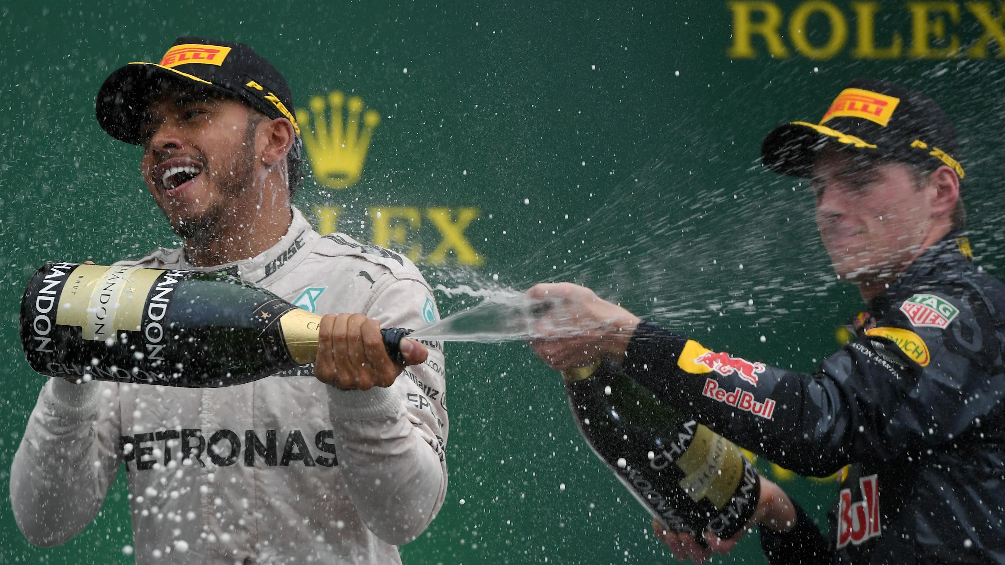 Lewis Hamilton (GBR) Mercedes AMG F1 and Max Verstappen (NED) Red Bull Racing celebrate on the