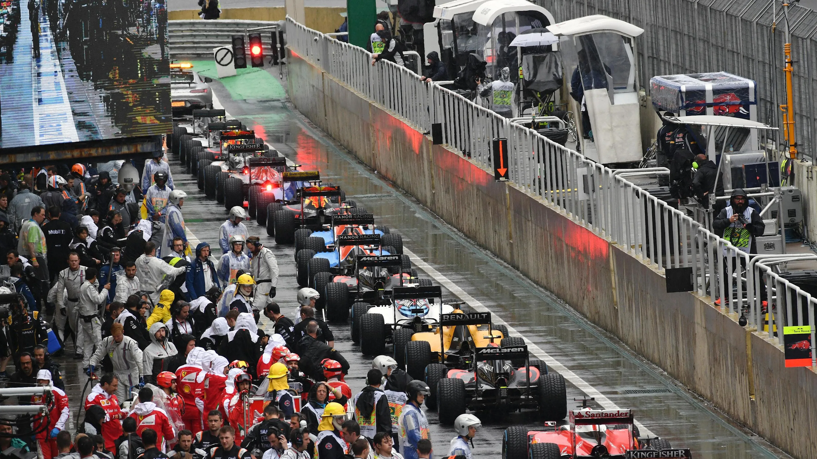 Cars in pit lane after the race suspension at Formula One World Championship, Rd20, Brazilian Grand
