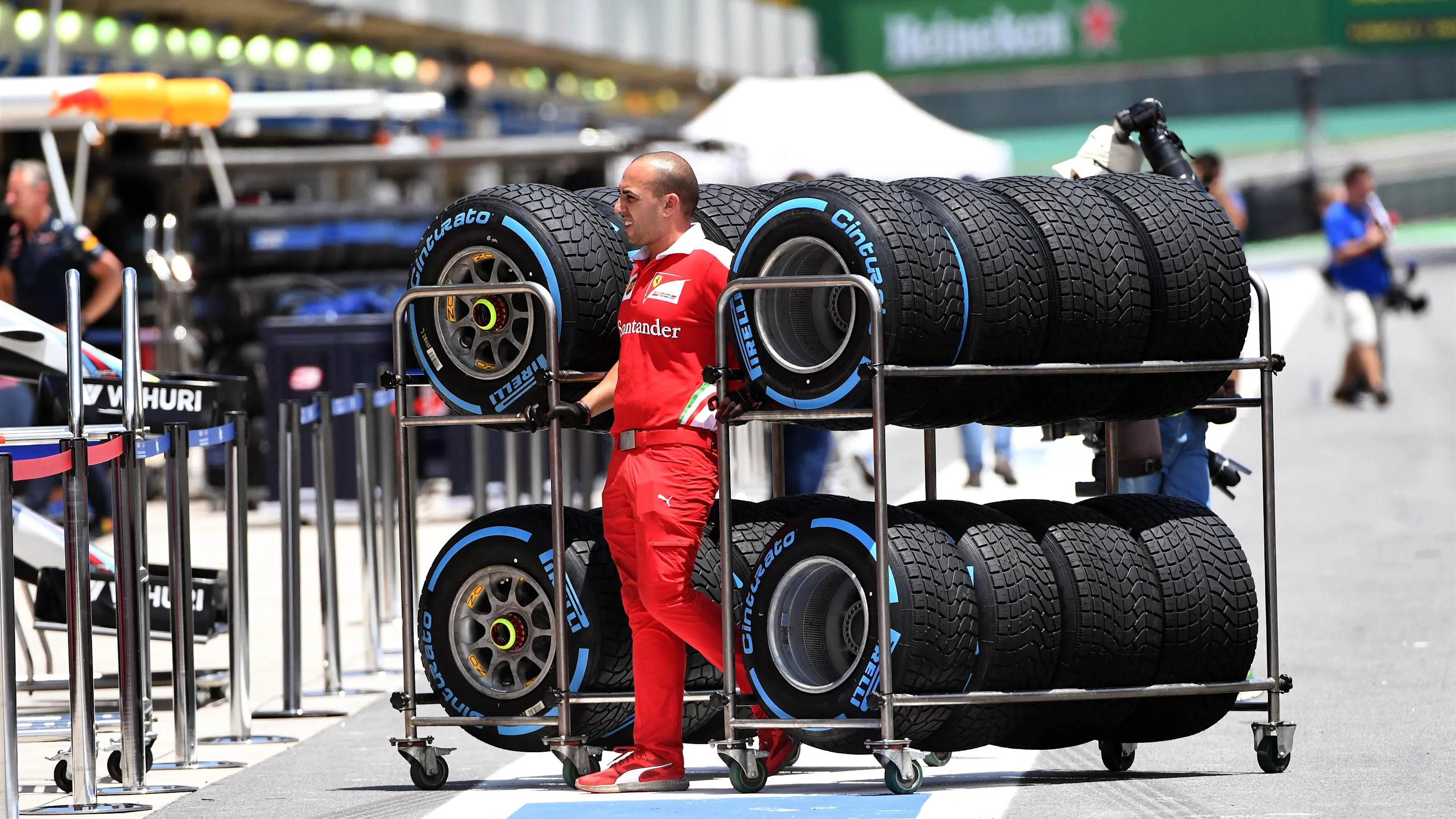 Ferrari mechanic with Pirelli tyres at Formula One World Championship, Rd20, Brazilian Grand Prix,