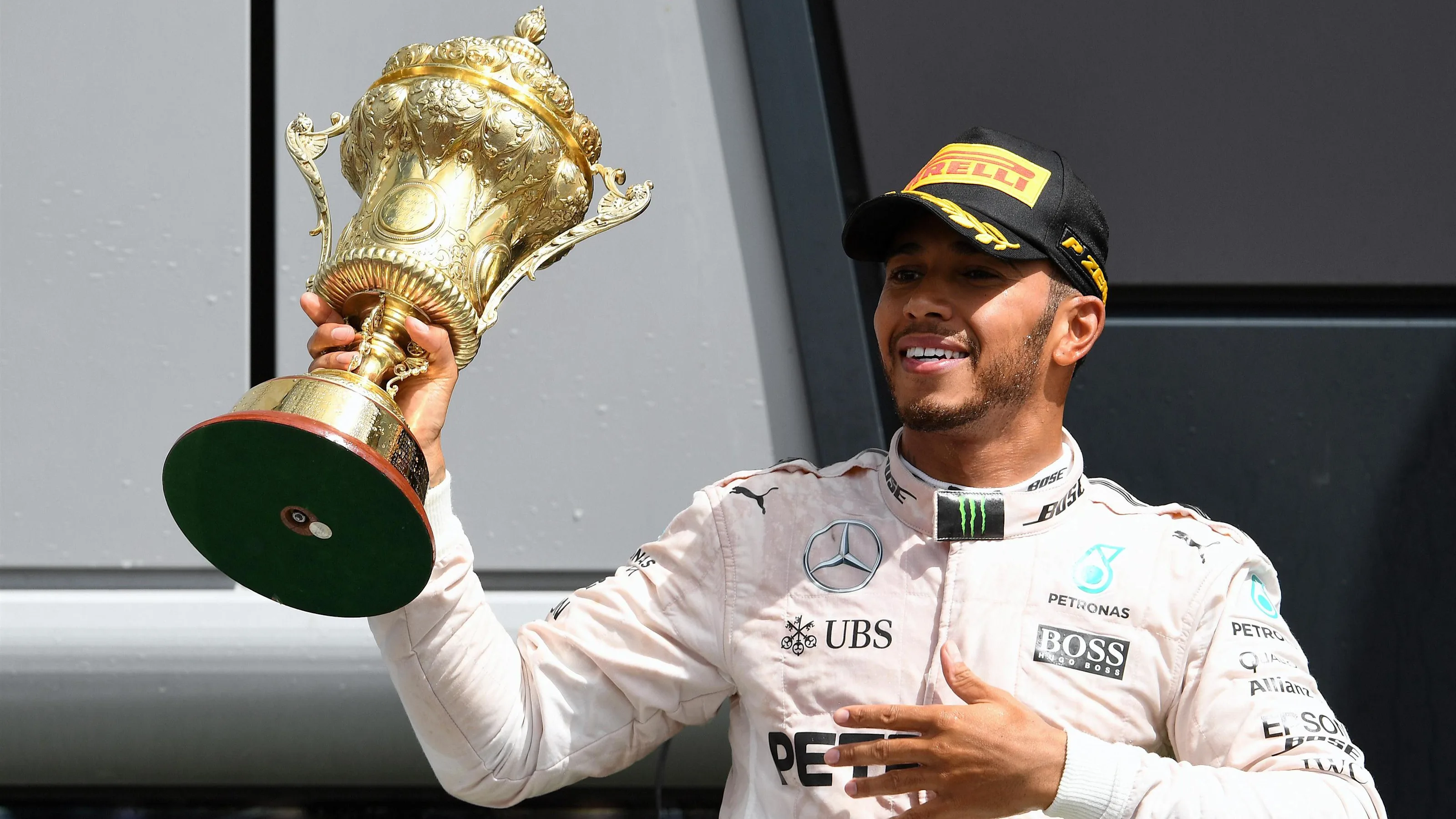 Race winner Lewis Hamilton (GBR) Mercedes AMG F1 celebrates on the podium with the trophy at
