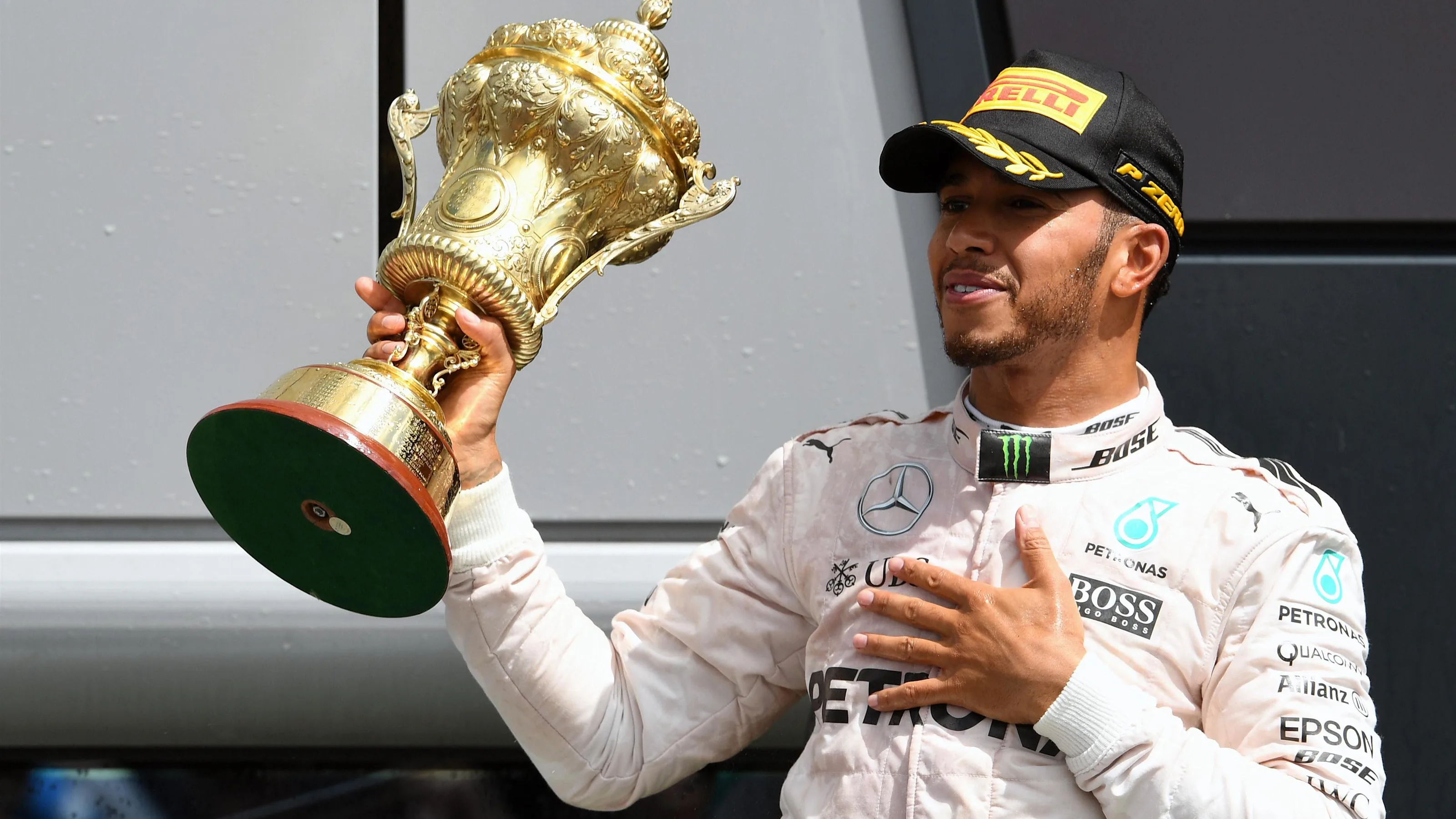 Race winner Lewis Hamilton (GBR) Mercedes AMG F1 celebrates on the podium with the trophy at