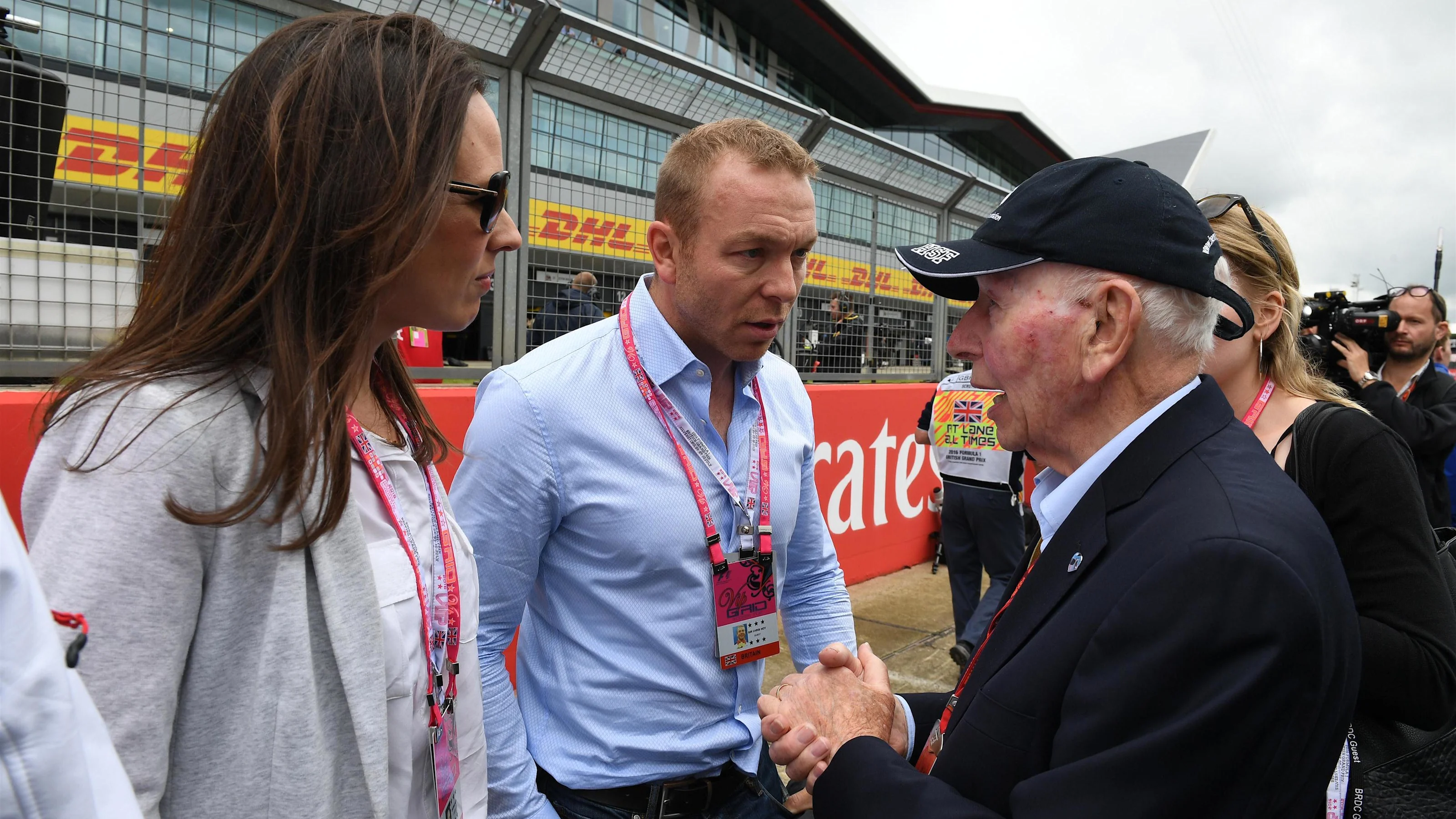 Chris Hoy (GBR) and wife Sarra Kemp (GBR) on the grid with John Surtees (GBR) at Formula One World