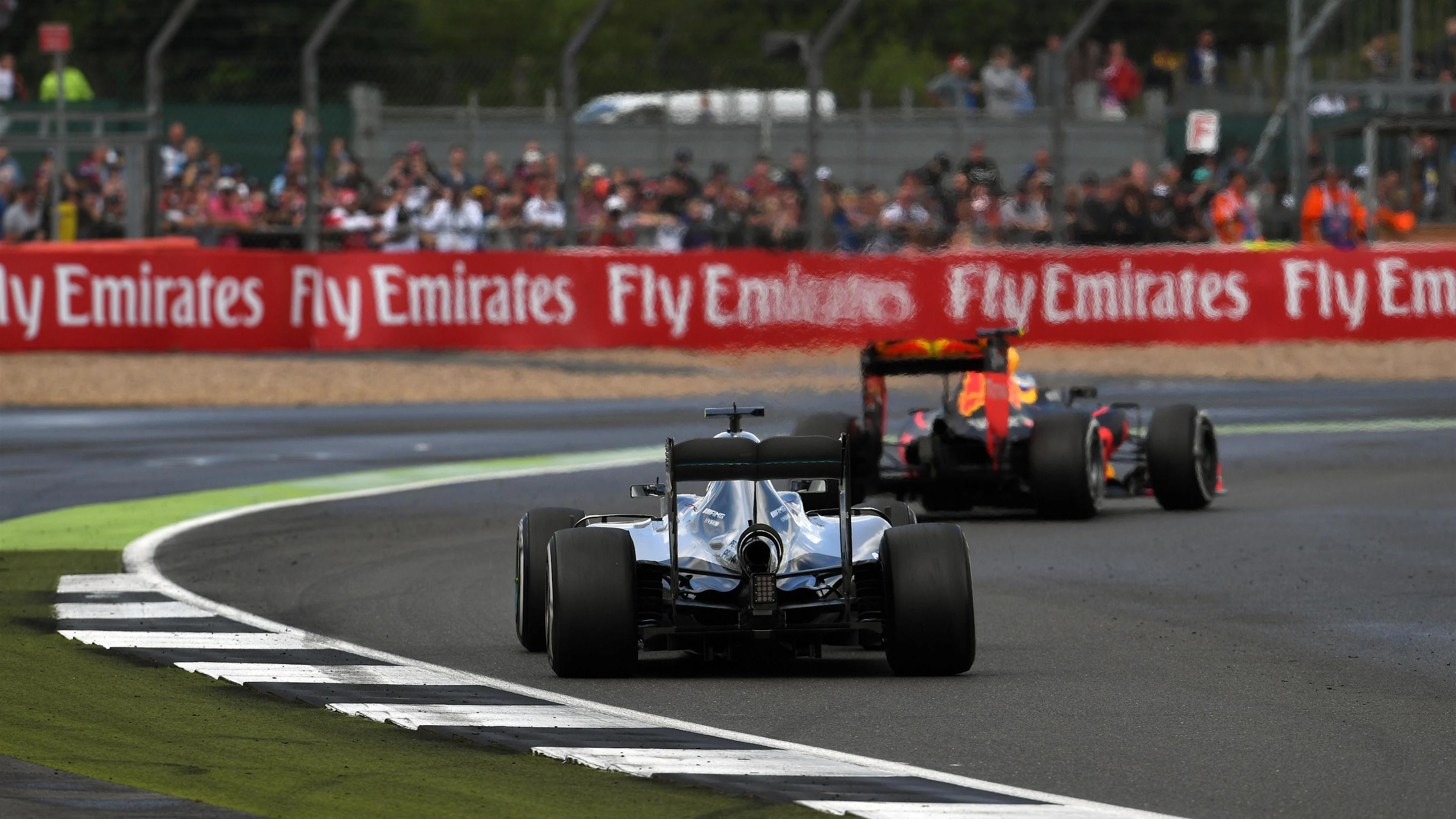 Max Verstappen (NED) Red Bull Racing RB12 and Nico Rosberg (GER) Mercedes-Benz F1 W07 Hybrid at