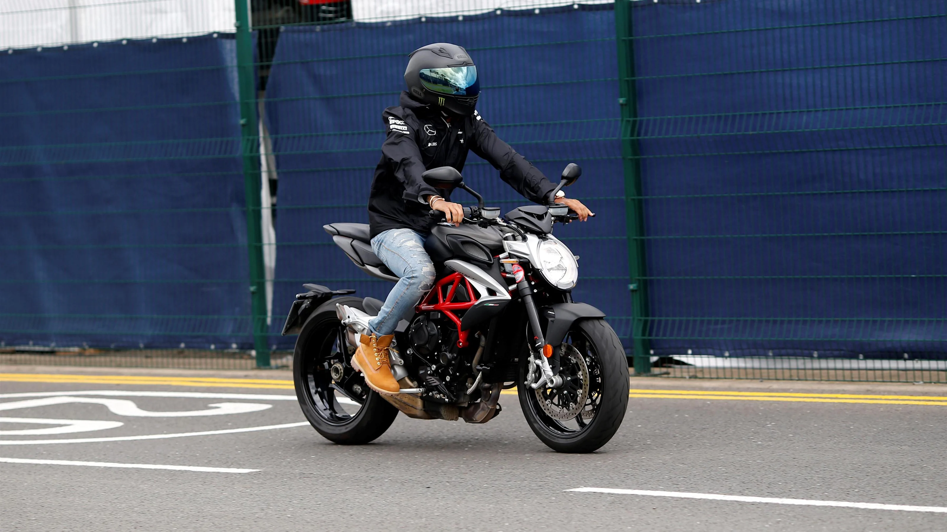 Lewis Hamilton (GBR) Mercedes AMG F1 on a MV Agusta Dragster motorcycle at Formula One World