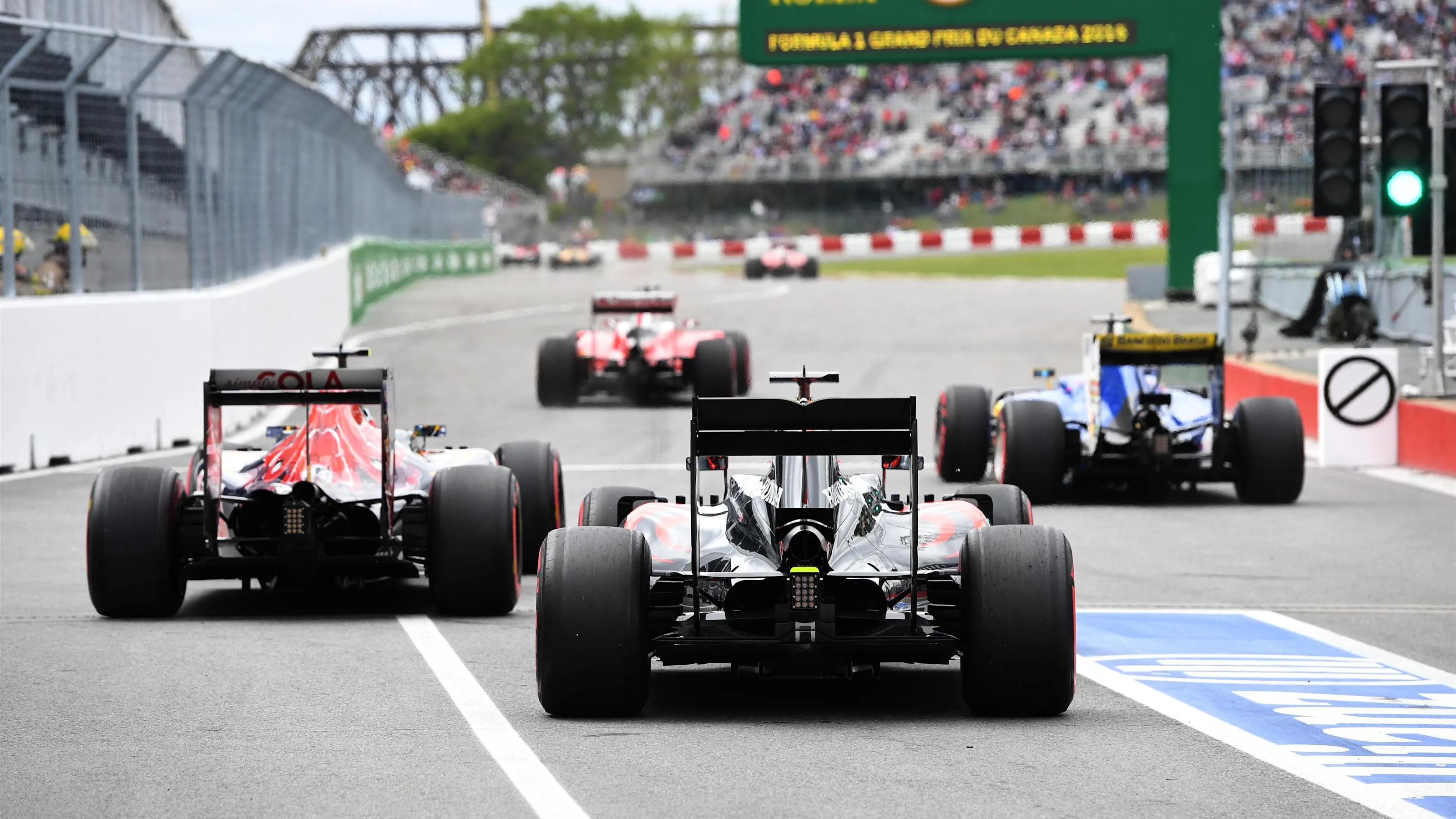 Cars leave pit lane at Formula One World Championship, Rd7, Canadian Grand Prix, Practice,
