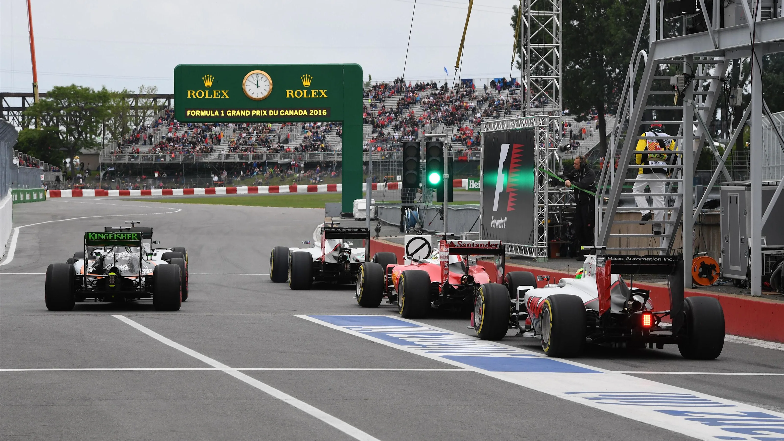 Cars leave pit lane at Formula One World Championship, Rd7, Canadian Grand Prix, Qualifying,