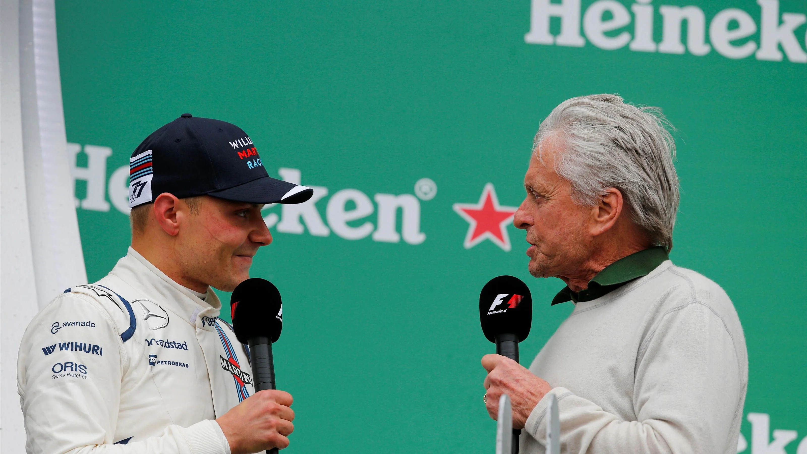 Valtteri Bottas (FIN) Williams and Michael Douglas (USA) Actor celebrate on the podium at Formula