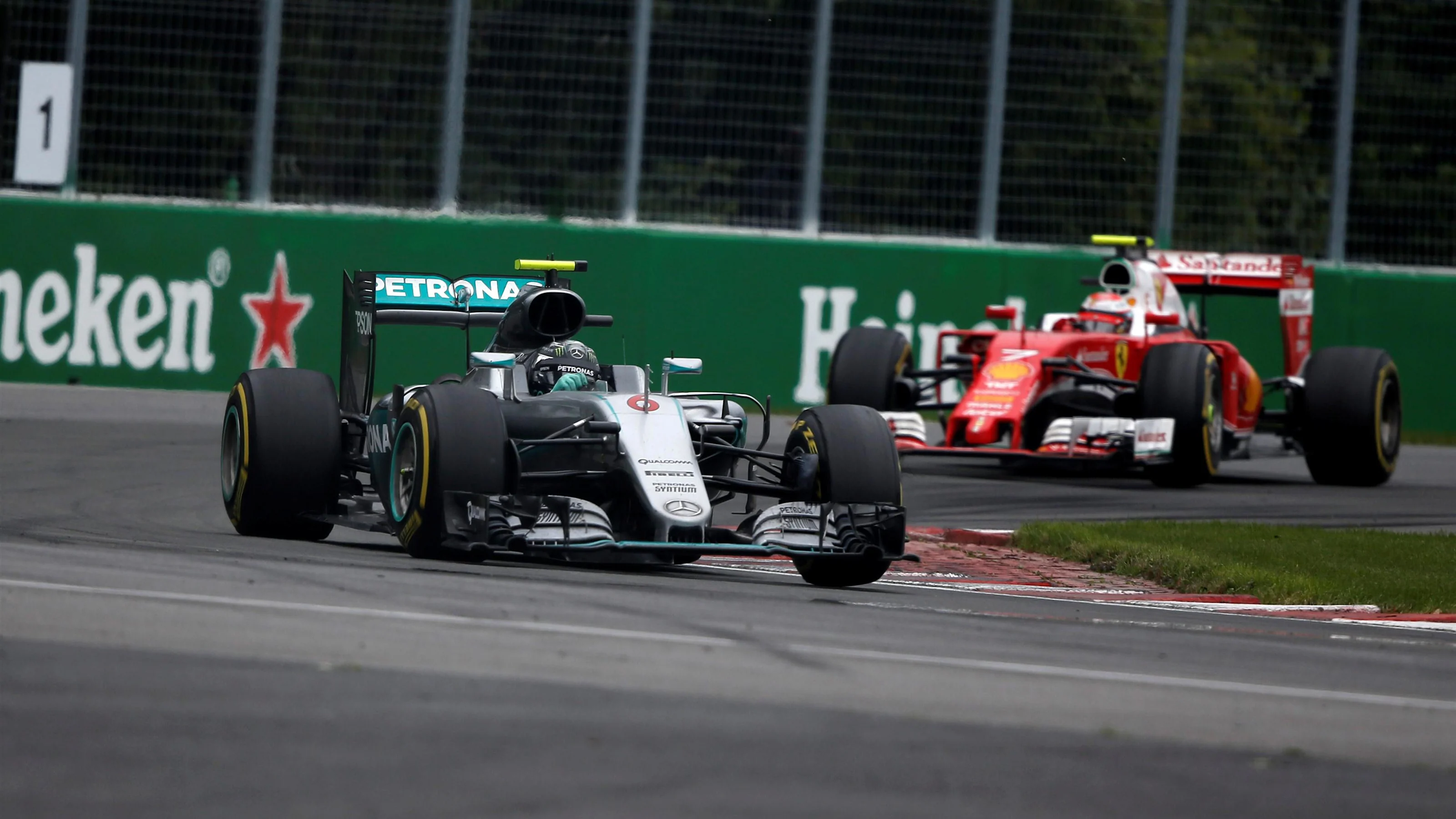 Nico Rosberg (GER) Mercedes-Benz F1 W07 Hybrid leads Kimi Raikkonen (FIN) Ferrari SF16-H at Formula